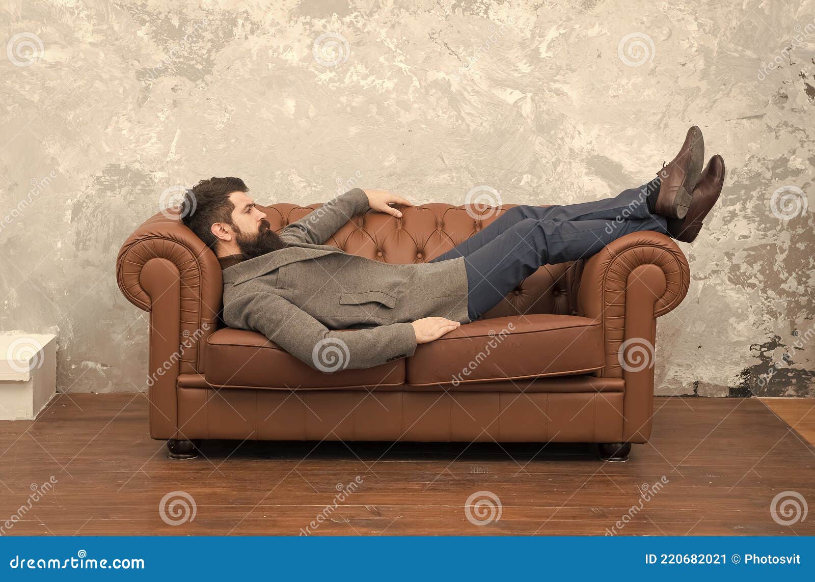 Man Relaxing on Luxurious Leather Couch, Furniture Store Concept Stock ...