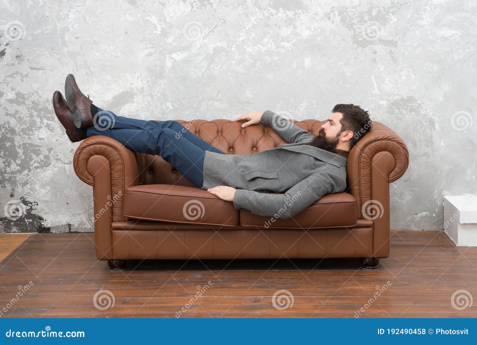 Man Relaxing on Luxurious Leather Couch, Furniture Store Concept Stock ...