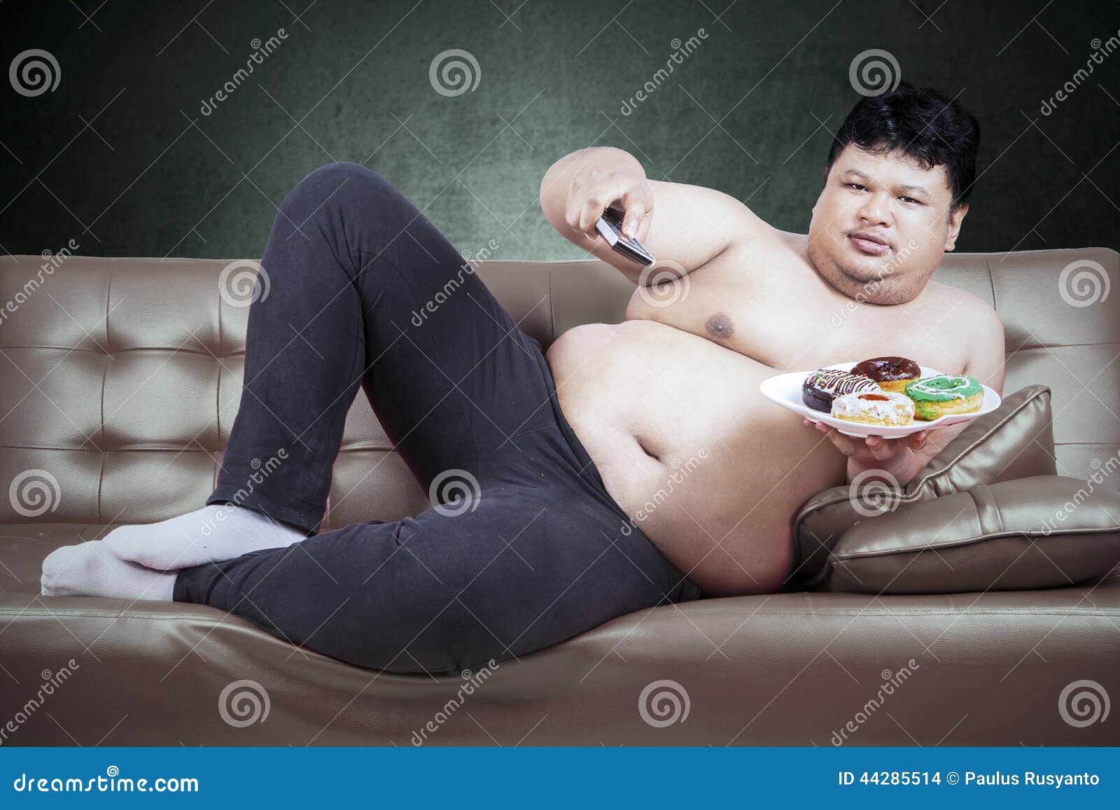 man-remote-tv-donuts-asian-fat-holding-home-44285514.jpg