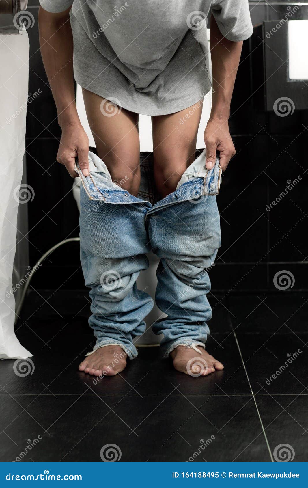 Man Removing His Underwear in Bathroom Stock Image - Image of hold