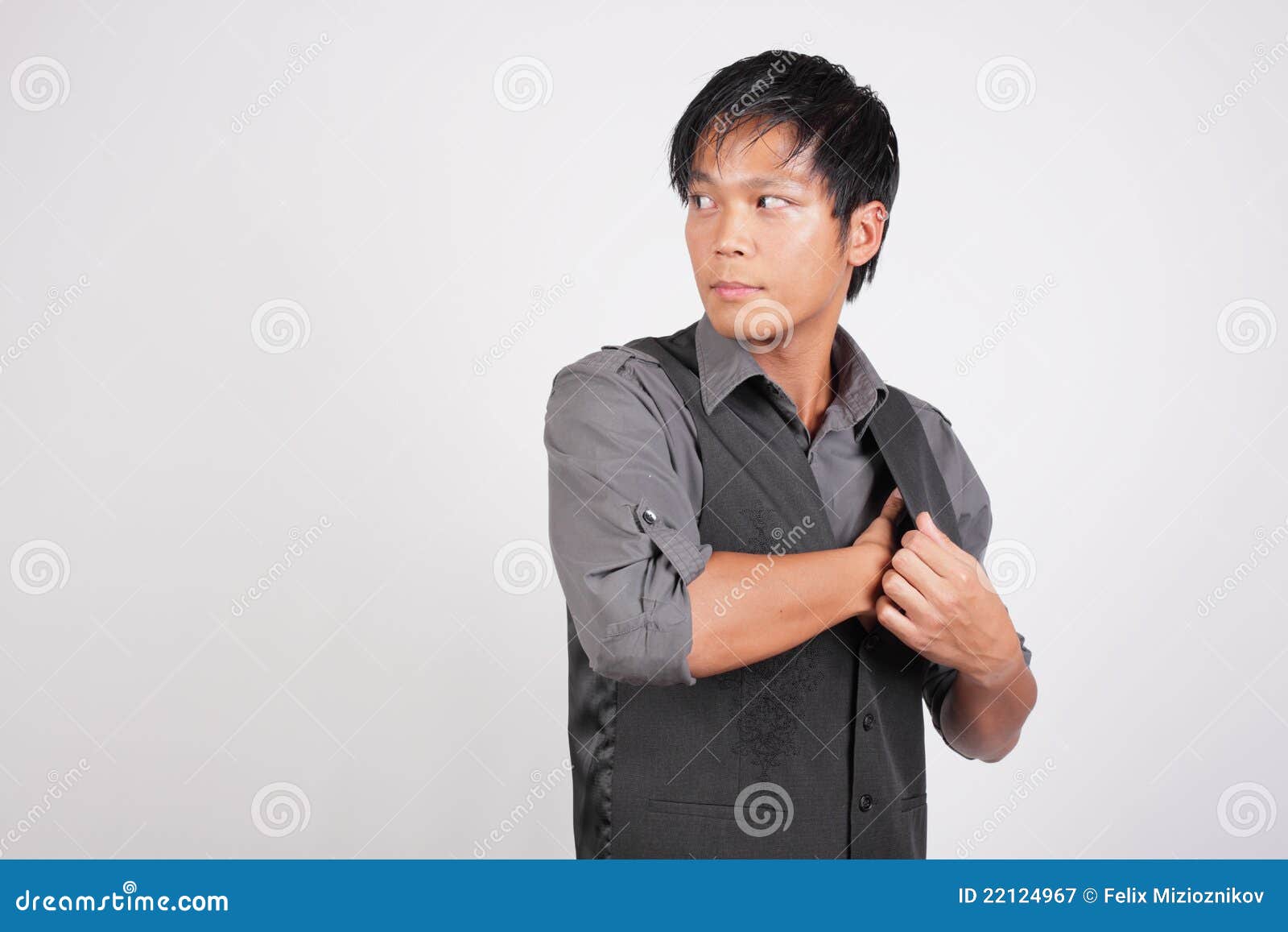 Man Removing Something from His Vest Stock Image Image of composition