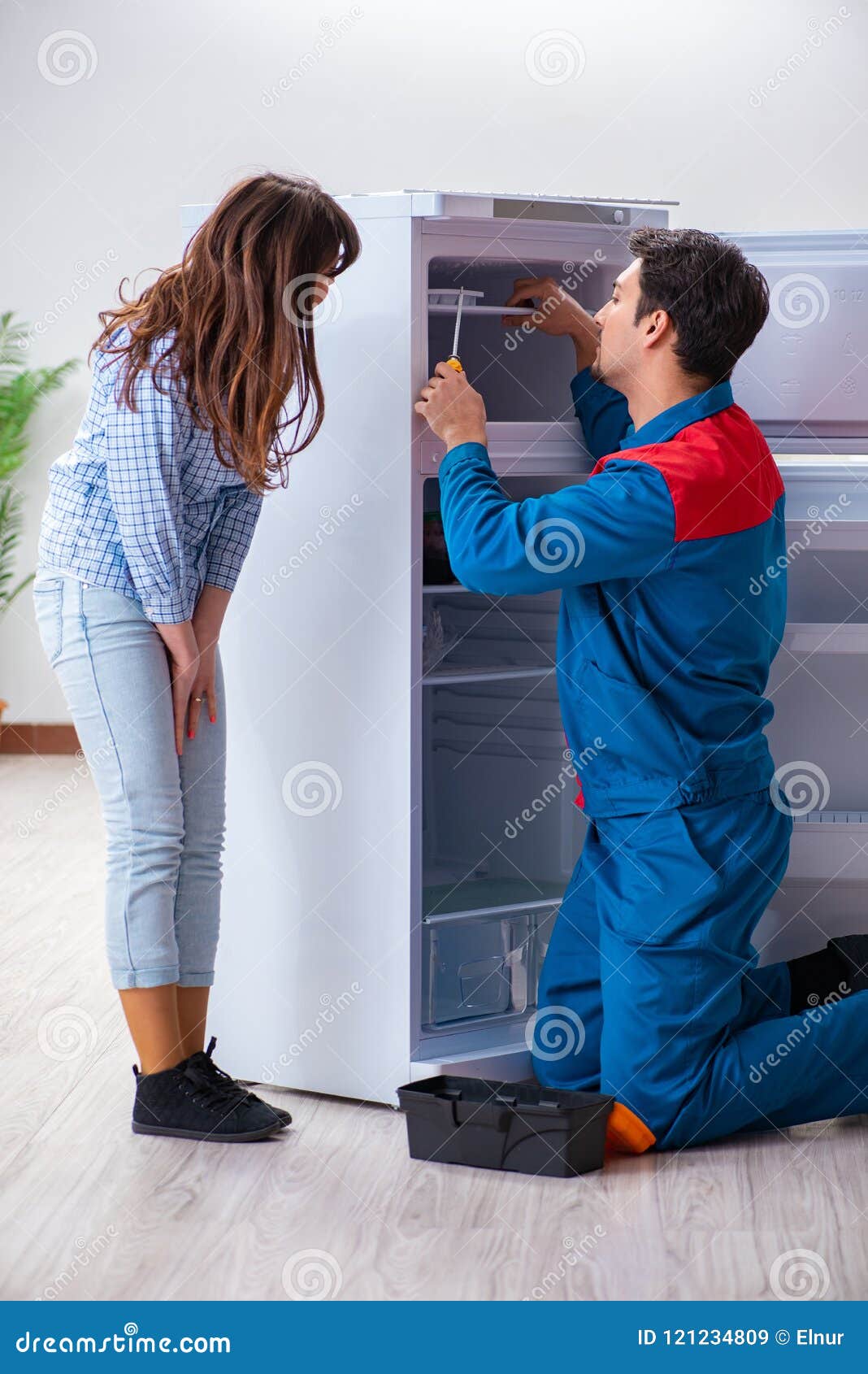 The Man Repairing Fridge with Customer Stock Image Image of