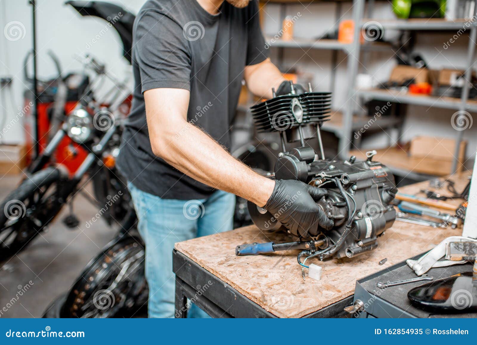 Man Repairing Motorcycle Engine Stock Image - Image of tool, garage