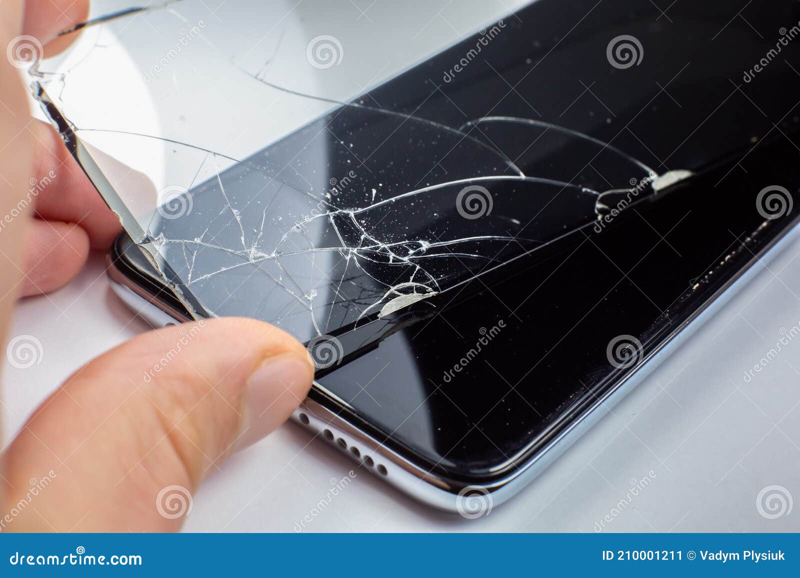 Man Replacing the Broken Tempered Glass Screen Protector for Smartphone
