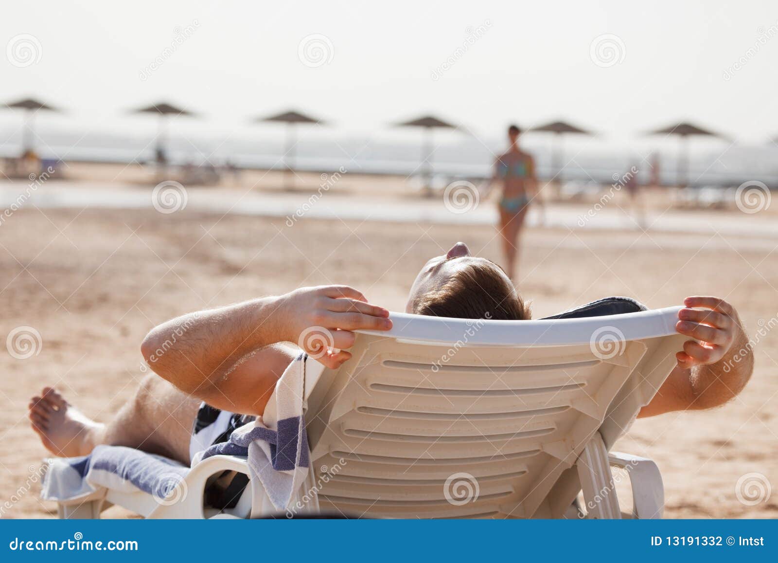 Man resting in beach chair stock photo. Image of relax 13191332