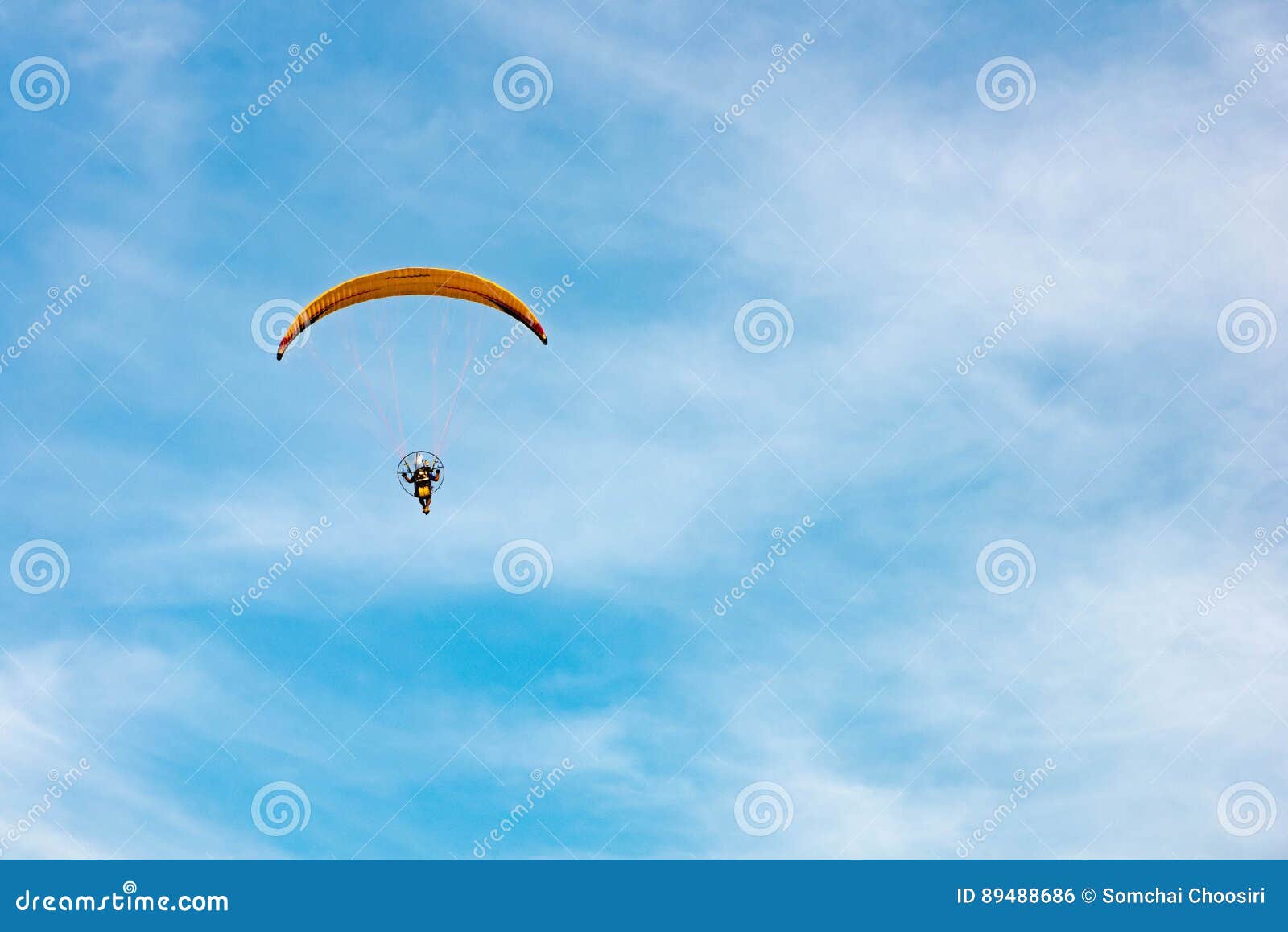 Man Ride Paramotor Flying in the Sky Stock Photo Image of blue