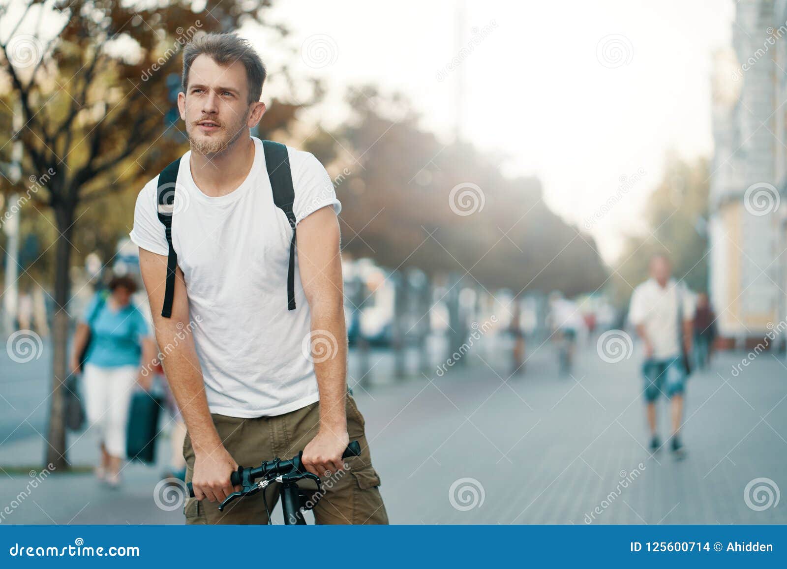 A Man Riding a Bike in an Old European City Outdoors Stock Photo ...