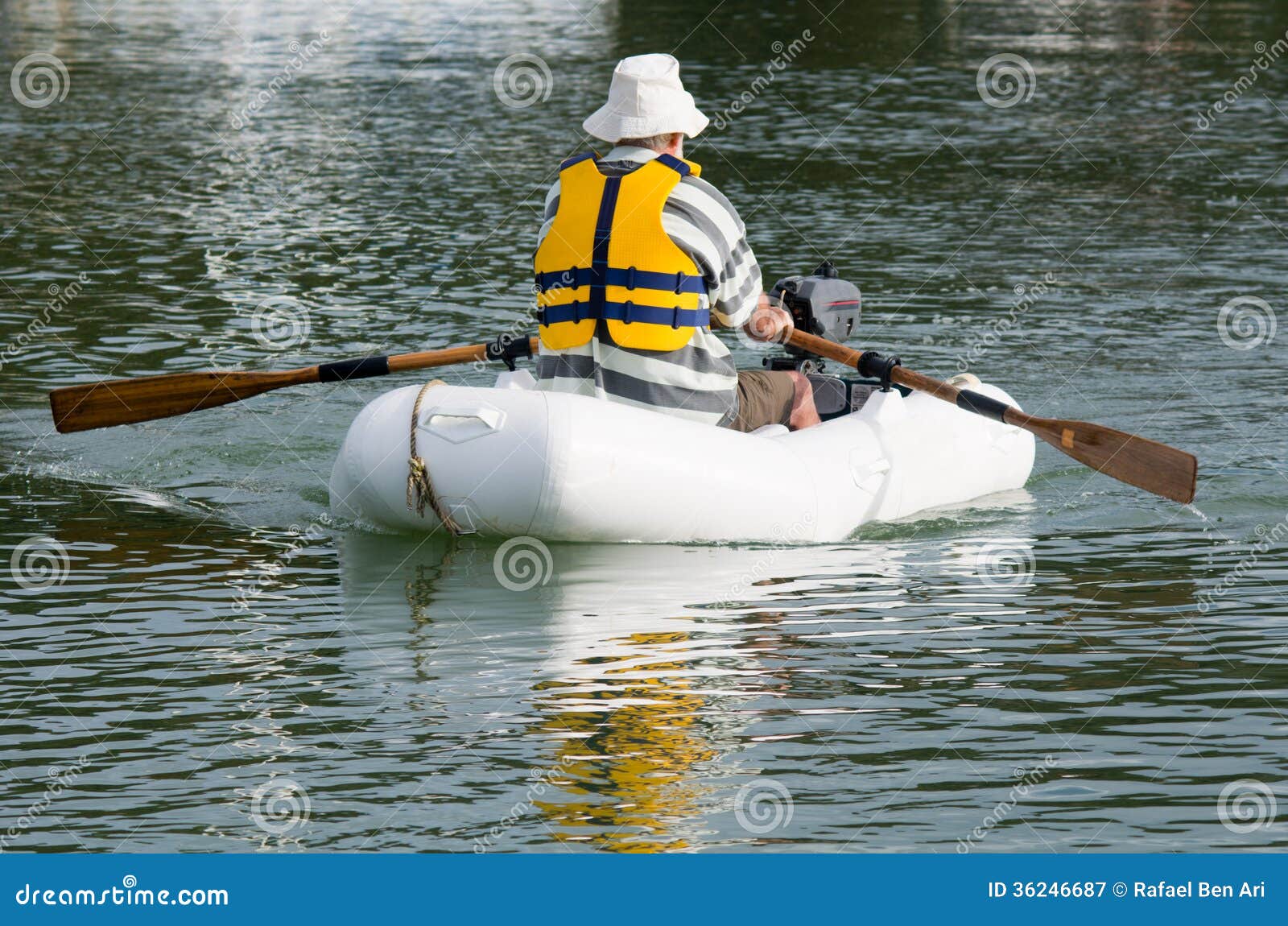 Man Rows Dinghy Boat Royalty Free Stock Photography 