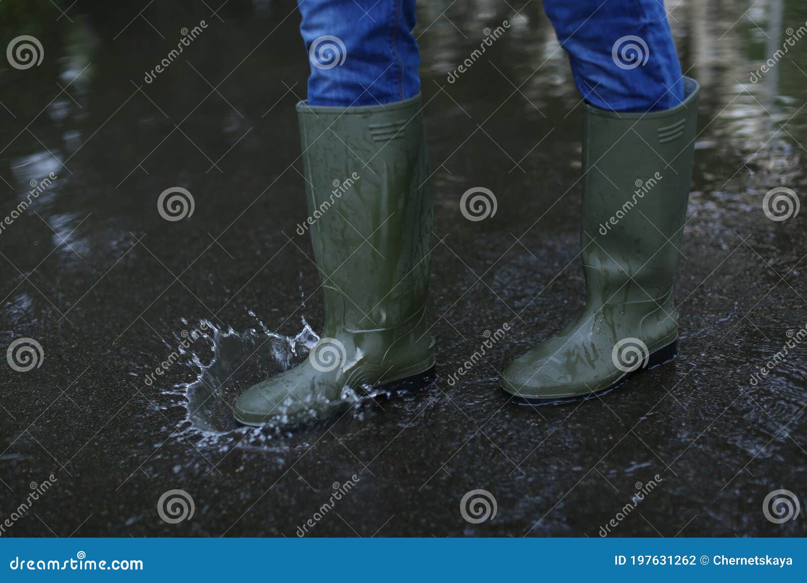 Man in Rubber Boots Walking on Wet Street after Rain, Closeup Stock ...