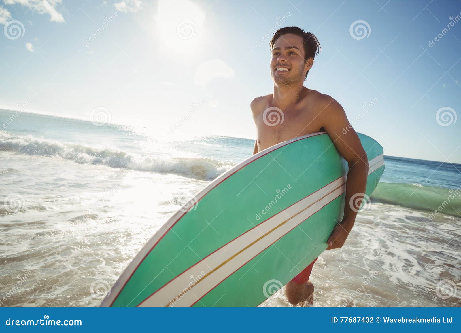 Man running on beach alone stock photo. Image of person - 77687402