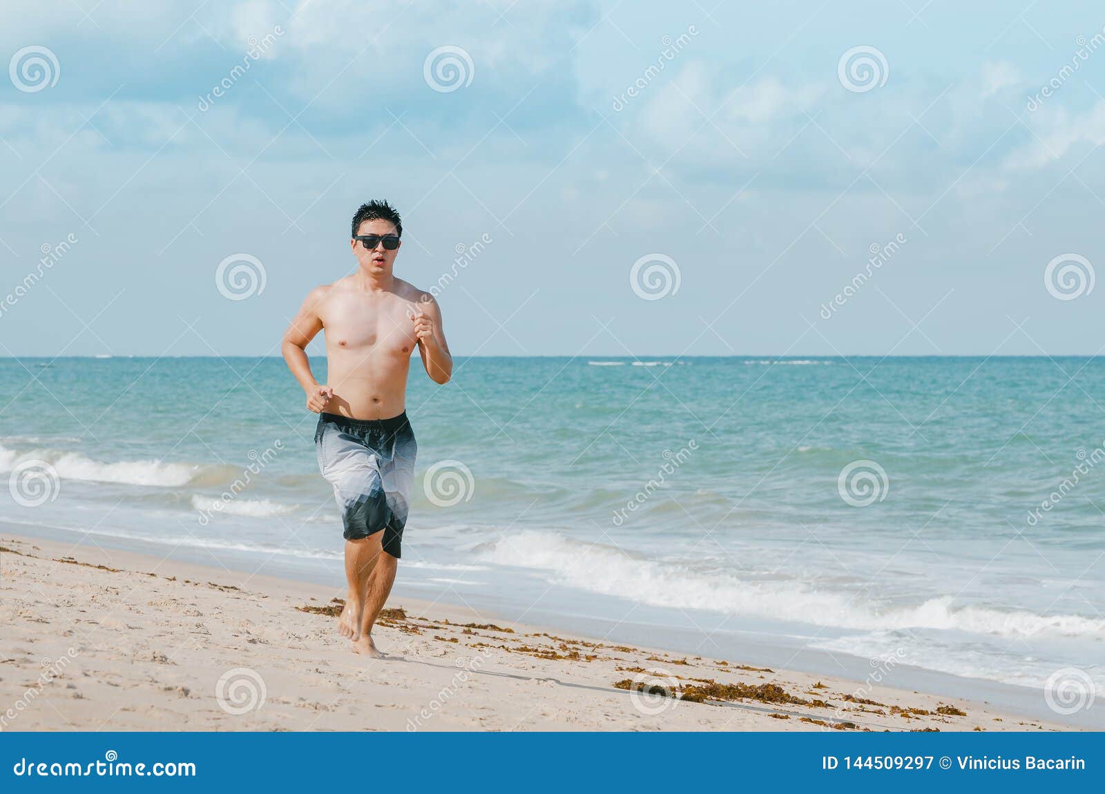 man running on the beach