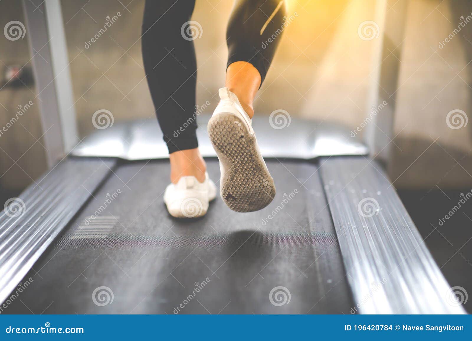 man running on treadmill  machine at gym sports club. fitness healthy lifestye and workout at gym concept. selective focus at mele