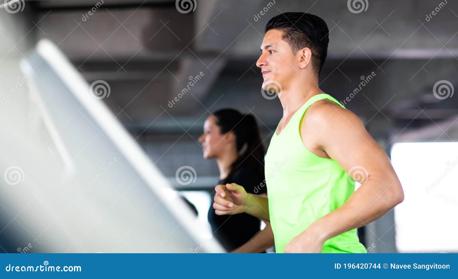 man running on treadmill  machine at gym sports club. fitness healthy lifestye and workout at gym concept