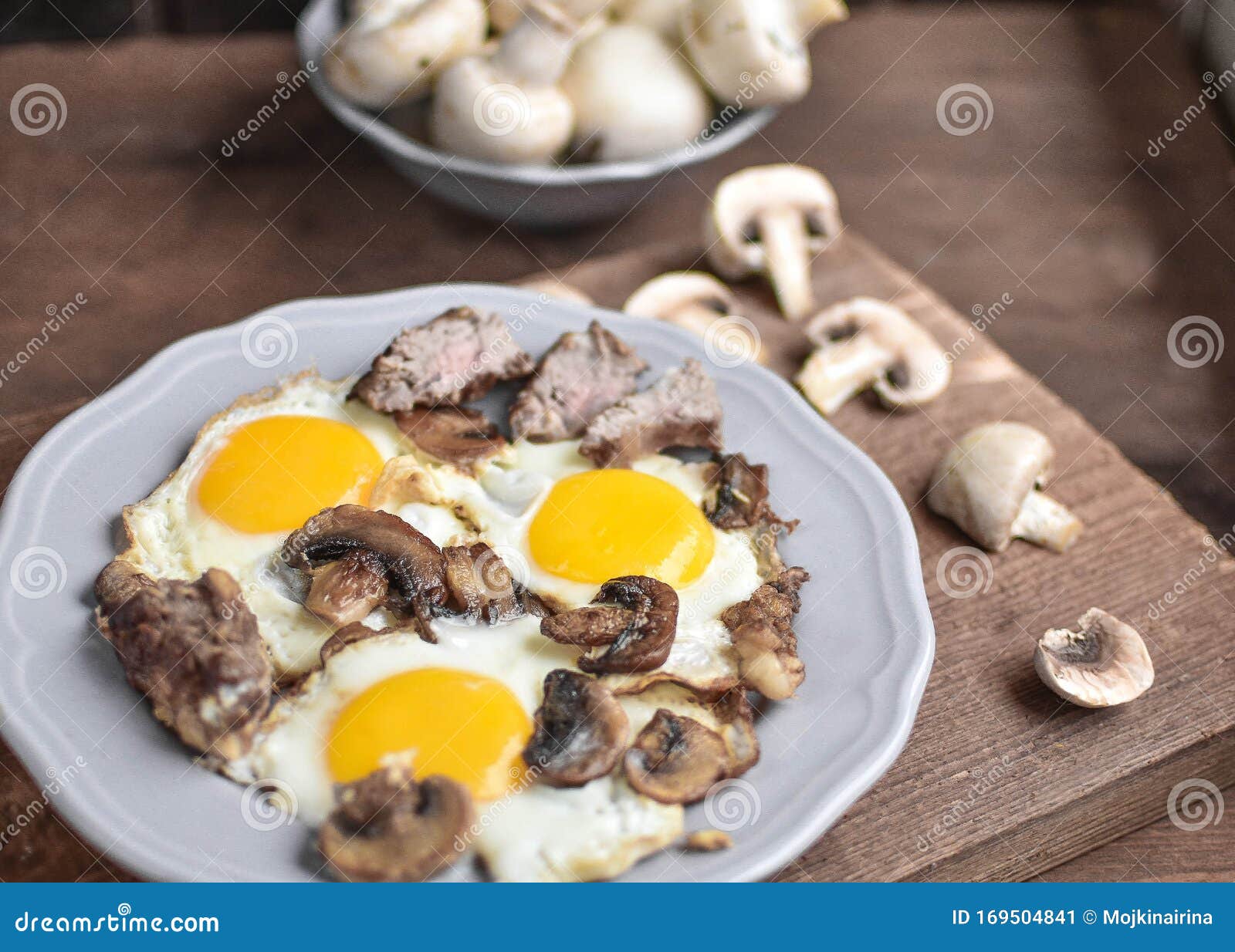 A Man `s Breakfast, a Egg with Mushrooms and Meat for Breakfast - this