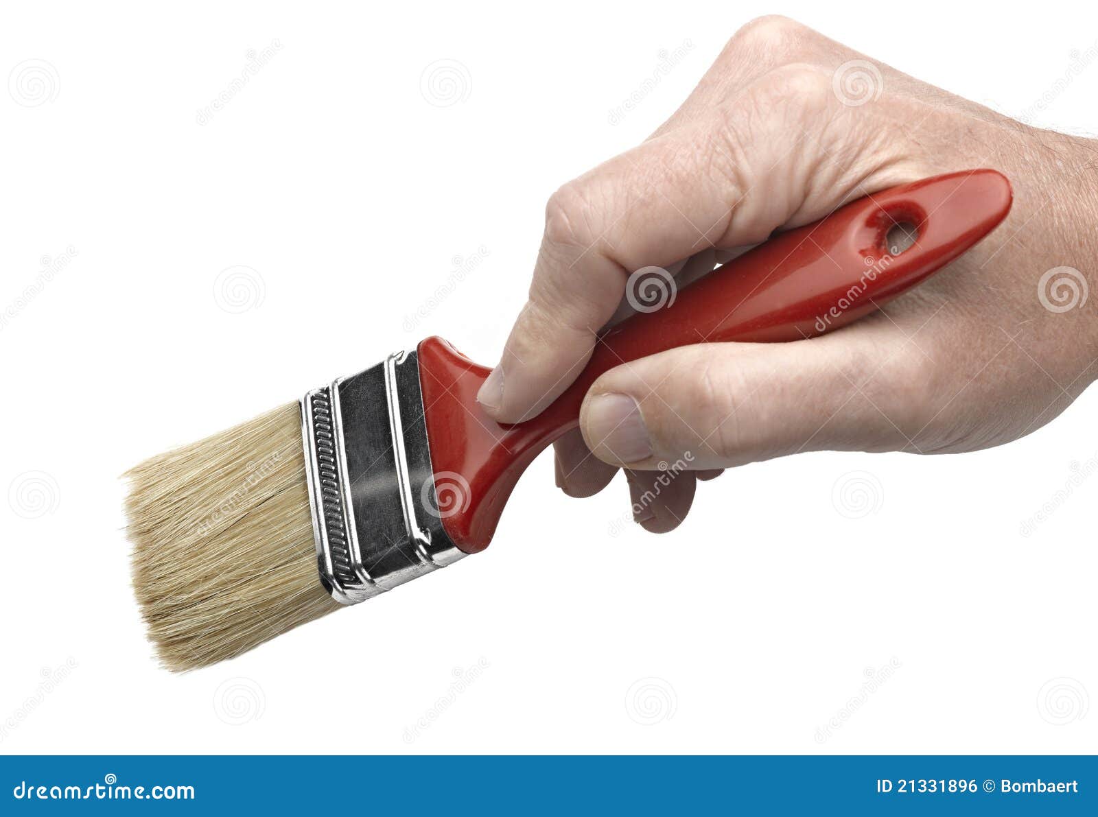 Close Up View Of A Hand Holding A Paintbrush High-Res Stock Photo