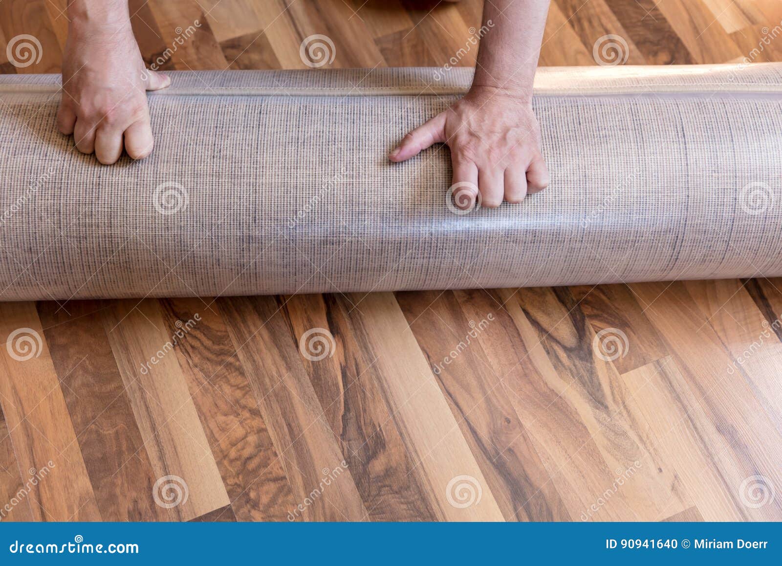 ManÂ´s Hand with a New Rolled Carpet on the Floor Stock Photo - Image ...