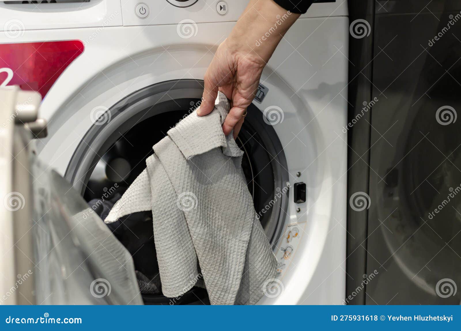 A Man S Hand Puts Dirty Things in the Washing Machine Stock Photo Image of electrical, laundry