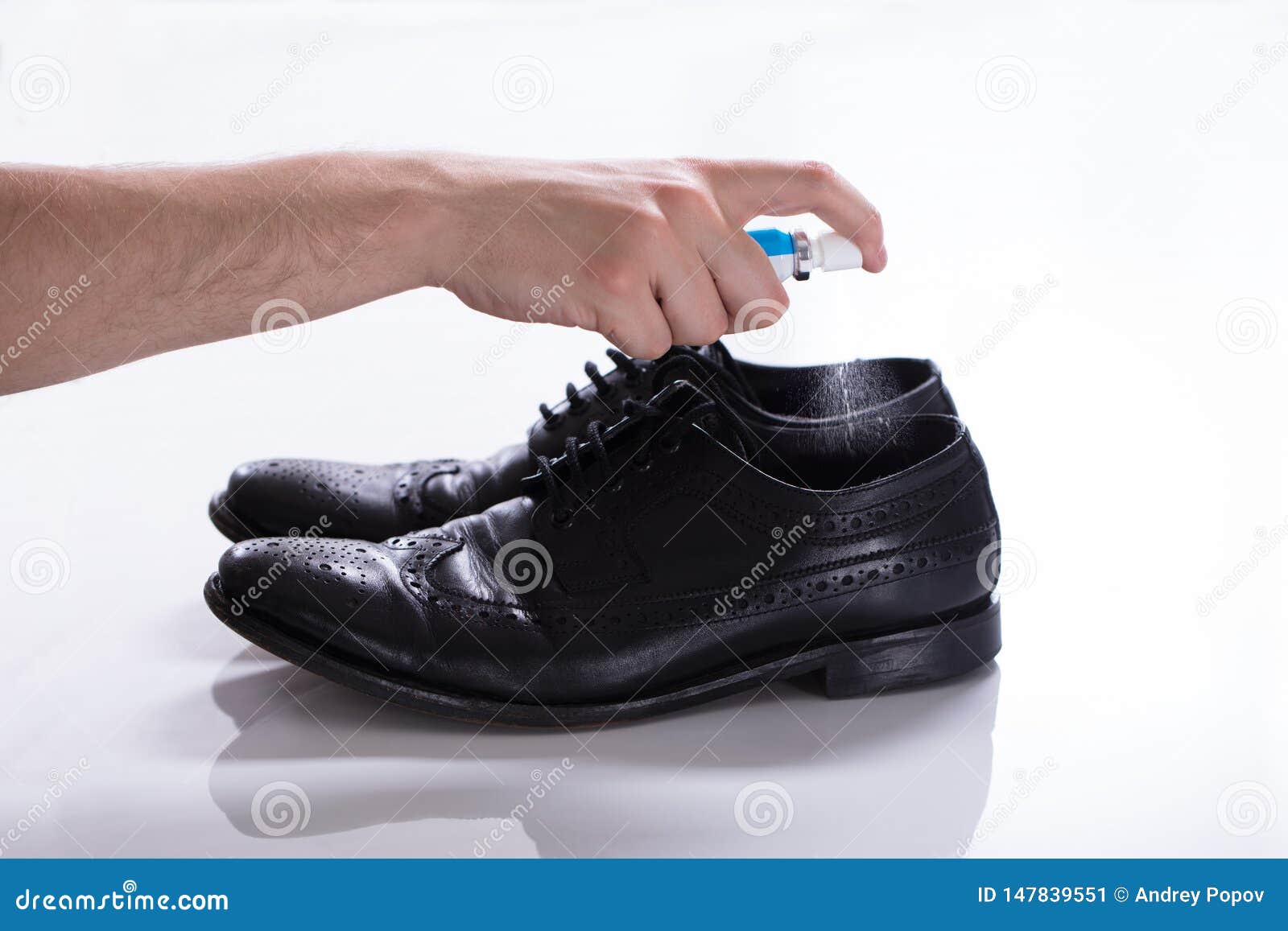 Man Spreading Deodorant on Smelly Shoes Stock Image - Image of isolated ...