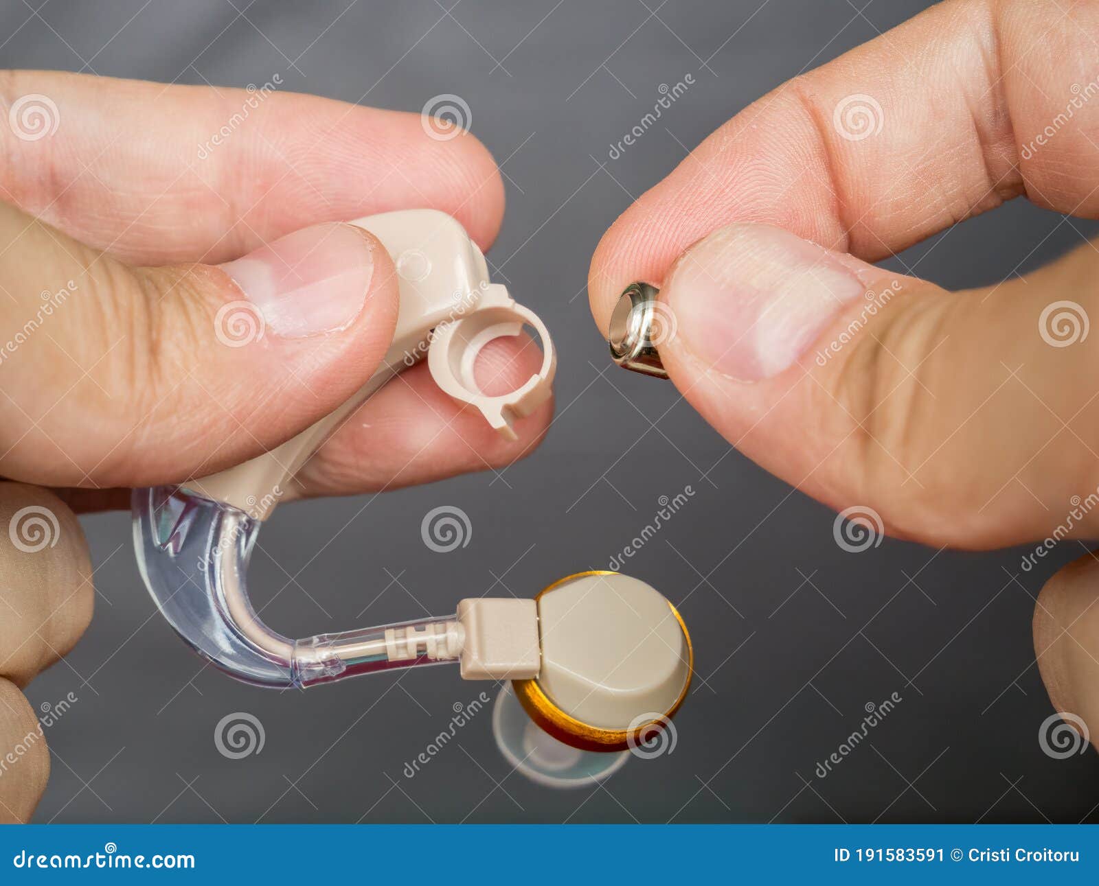 Man`s Hands Changing a Hearing Aid Battery Stock Image Image of macro