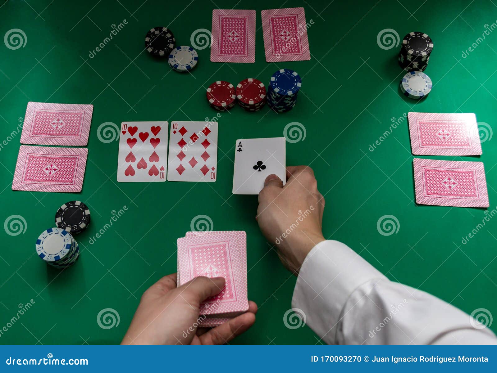 A Man`s Hands Dealing Poker Cards on a Board Stock Photo Image of