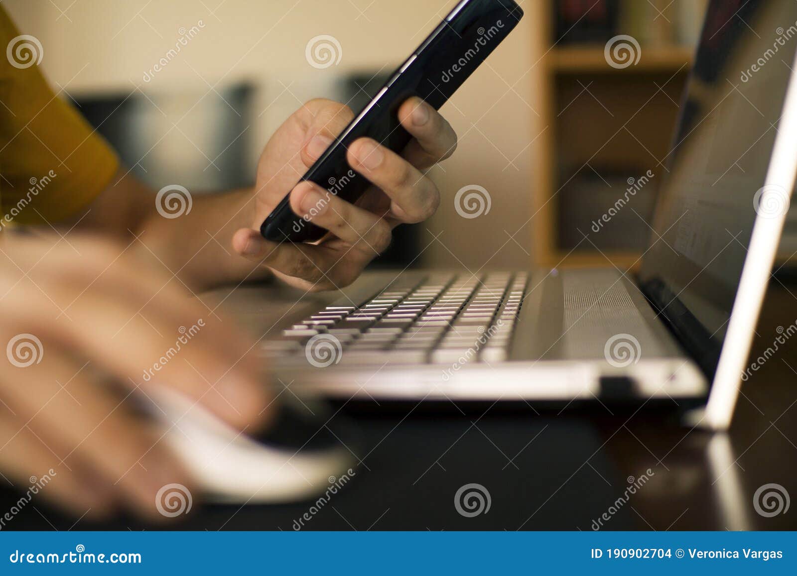 man`s hands teleworking from home