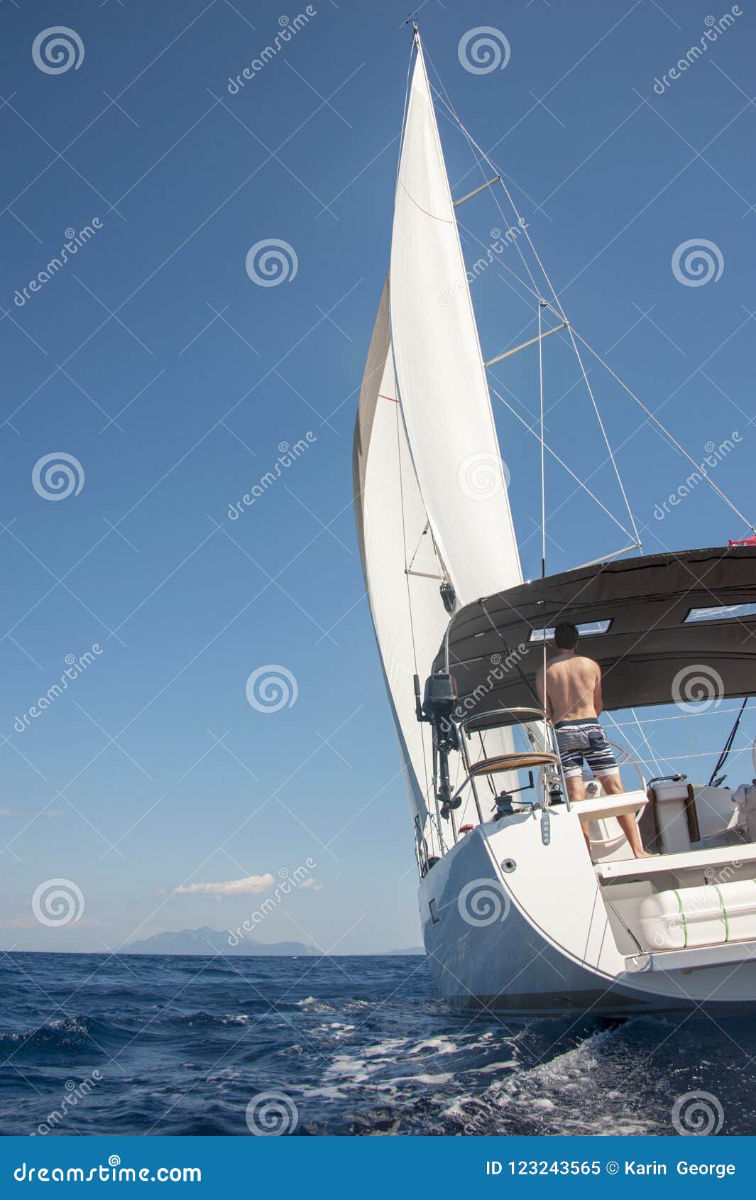 man sailing toward an island in croatia.