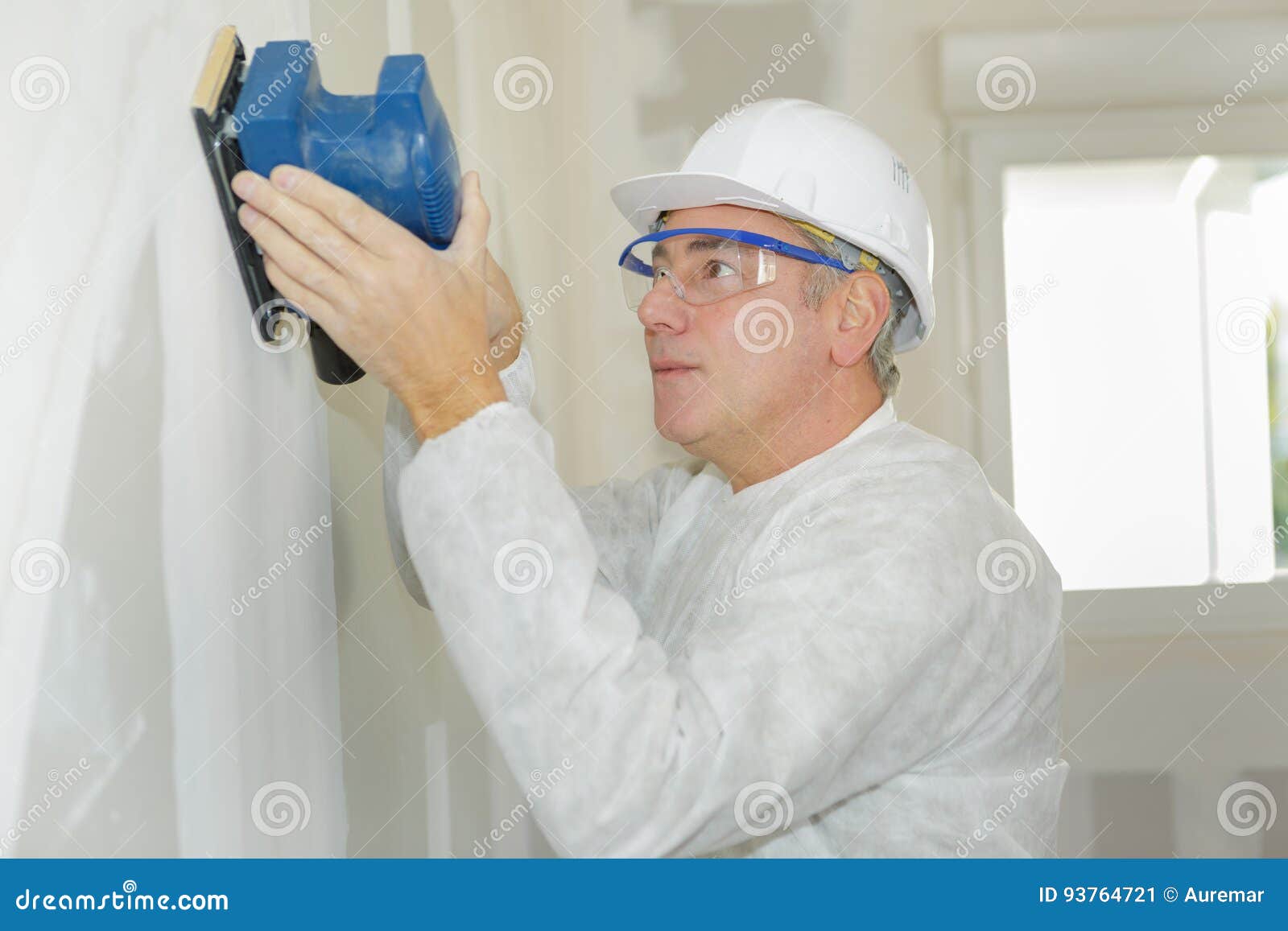Man Sanding Wall With Power Sander Stock Image Image Of