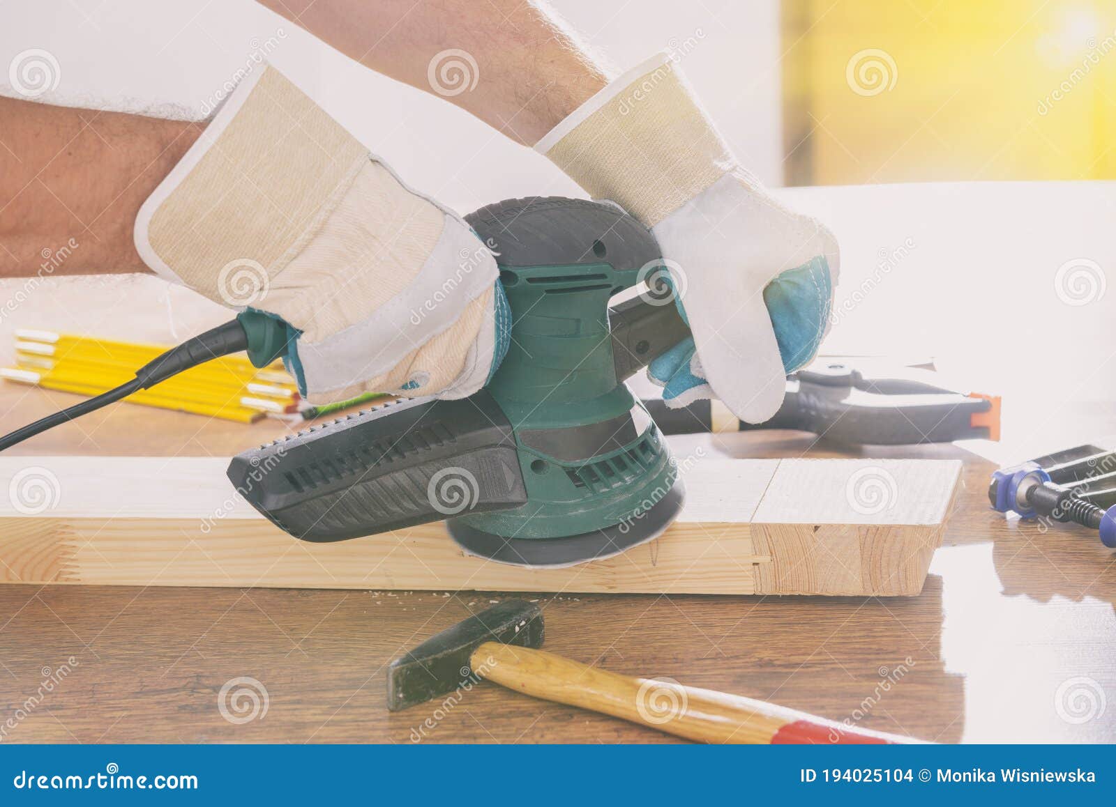 Man Sanding a Wood with Orbital Sander Stock Photo Image of people