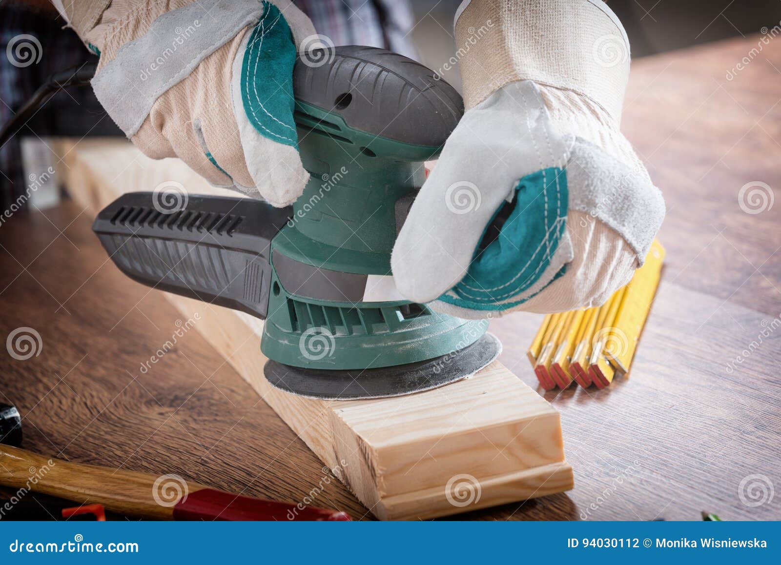 Man Sanding a Wood with Orbital Sander Stock Photo Image of
