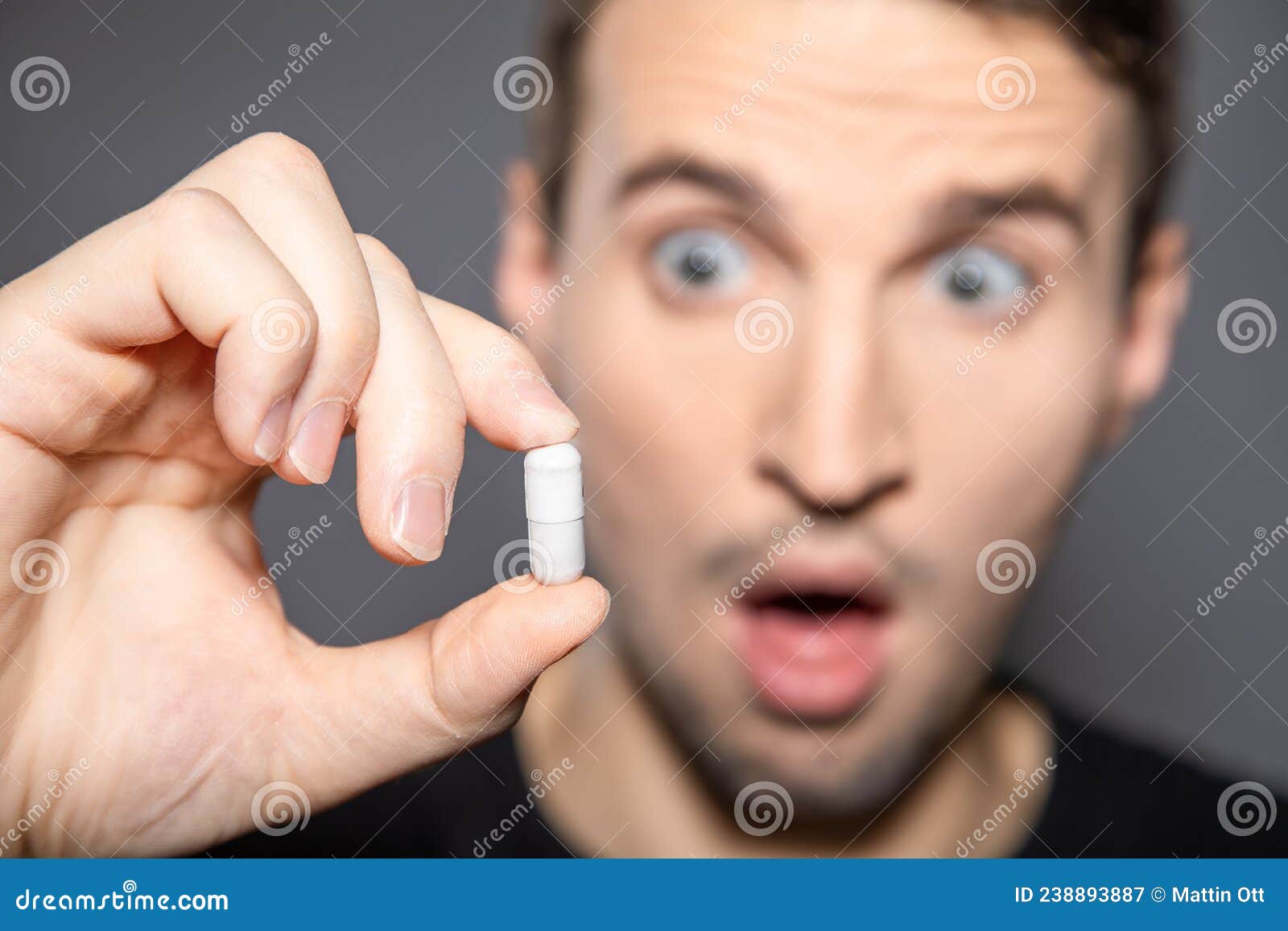 Man is Scared of Big White Capsule and Afraid of Taking that Huge Pill