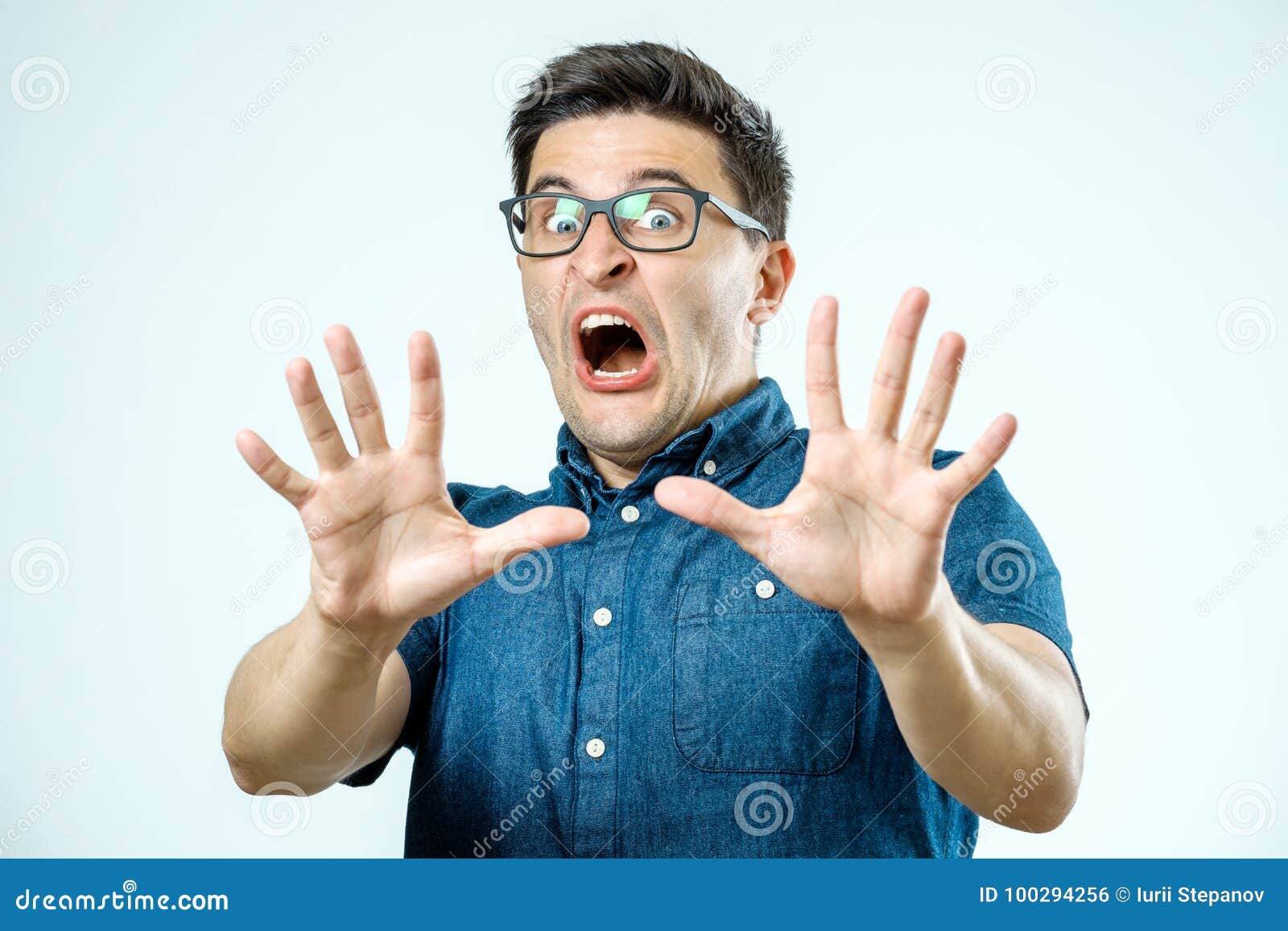 Man with Scared Expression on His Face Making Frightened Gesture Stock  Photo - Image of irony, funny: 100294256