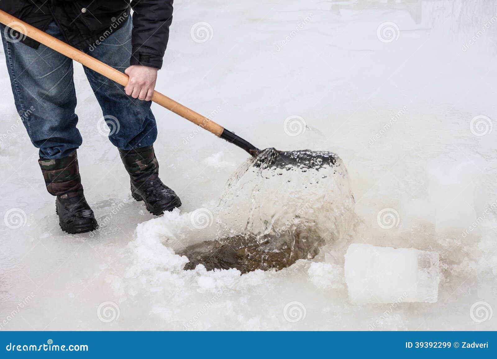 Man Scoops Chunks Ice Out Of The Hole Stock Image Image Of