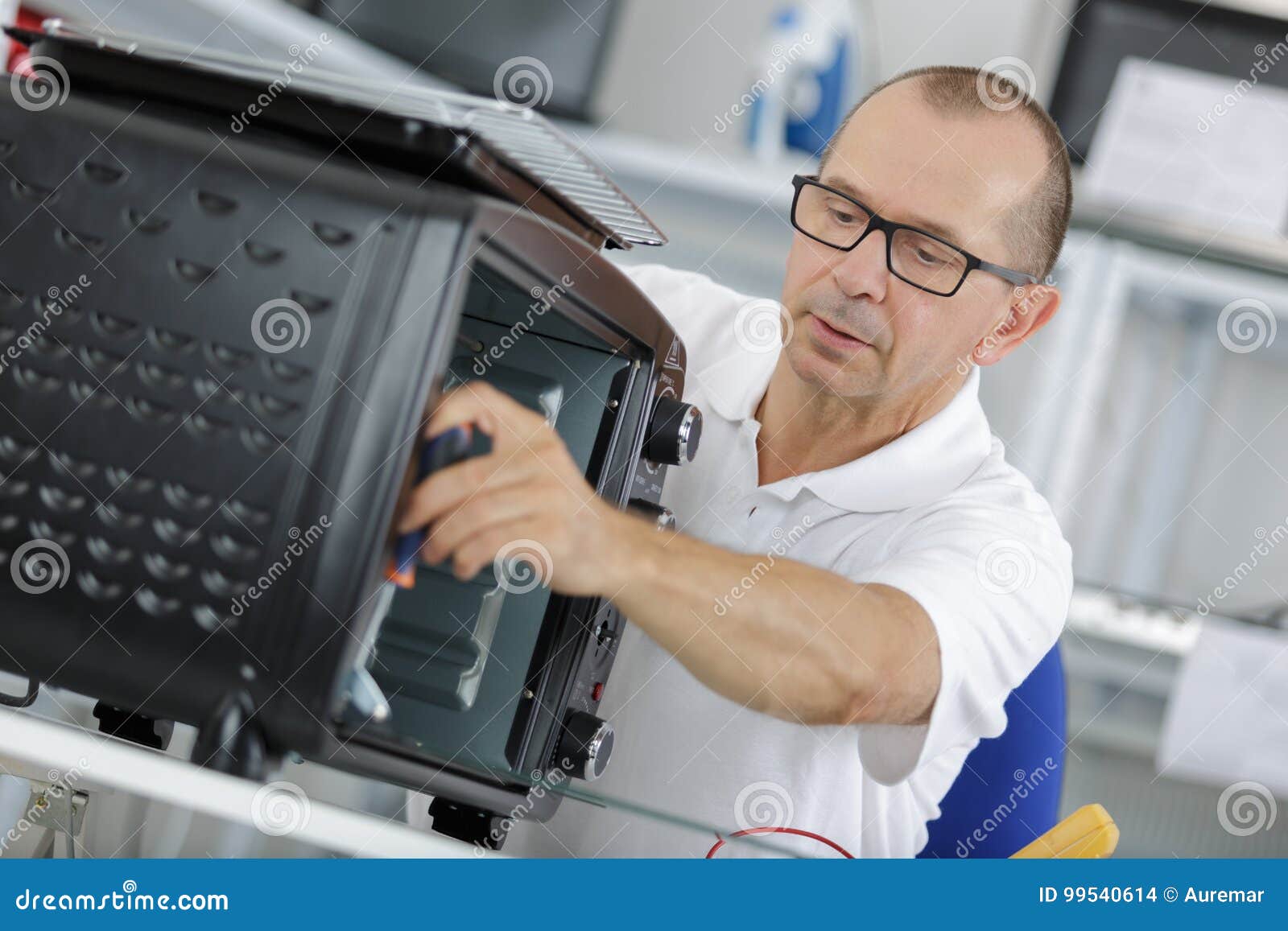 Man with Screwdriver Fixing Oven Door Stock Photo Image of expert