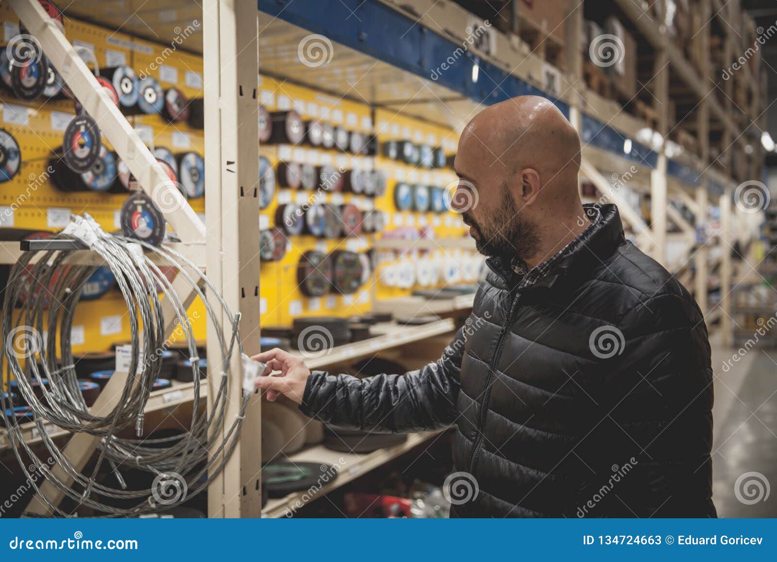 Man Selects in Specialty Stores Tools and Materials Stock Image Image