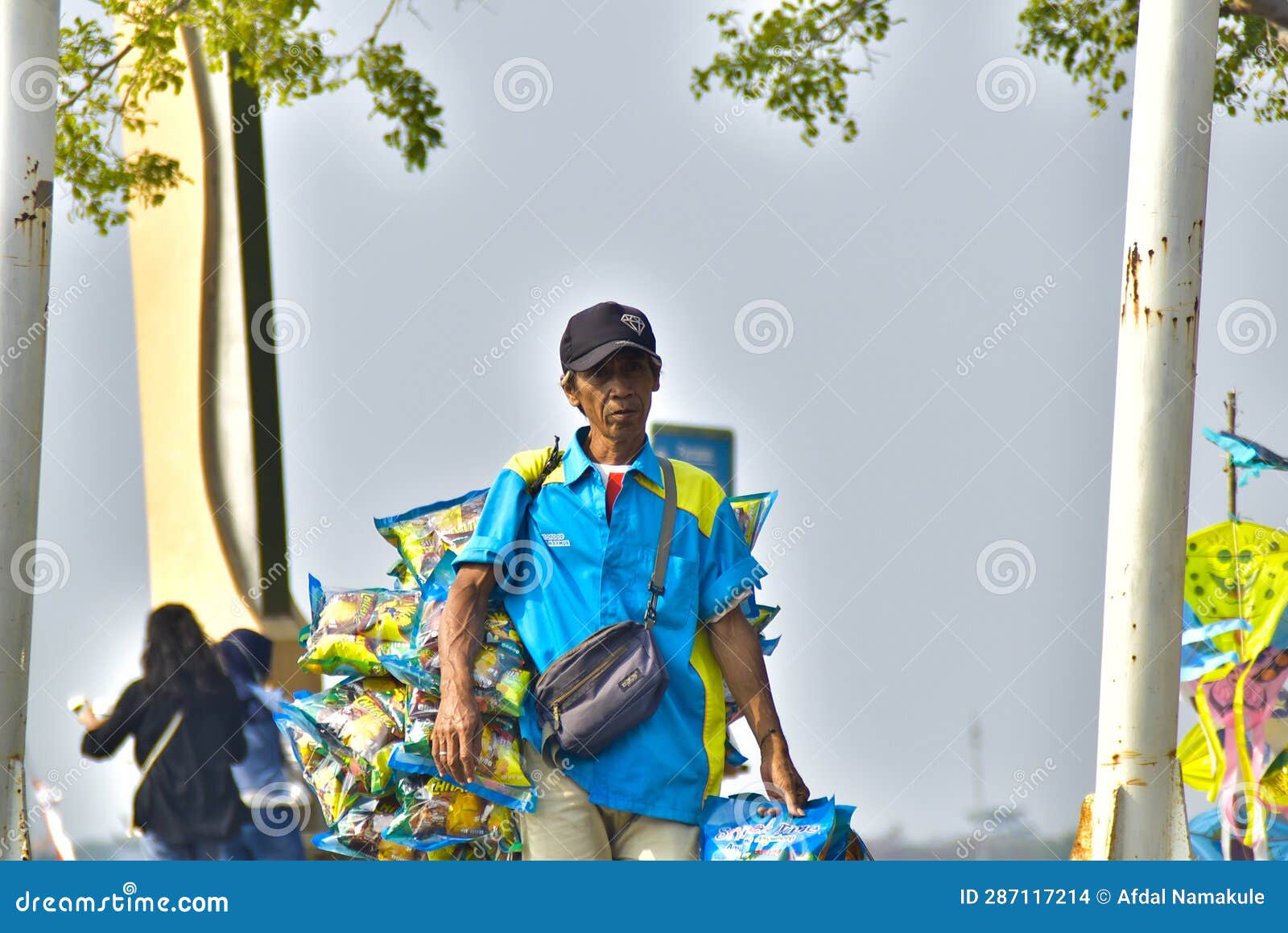 A Man Selling Snacks at Ancol Beach Jakarta Editorial Stock Image