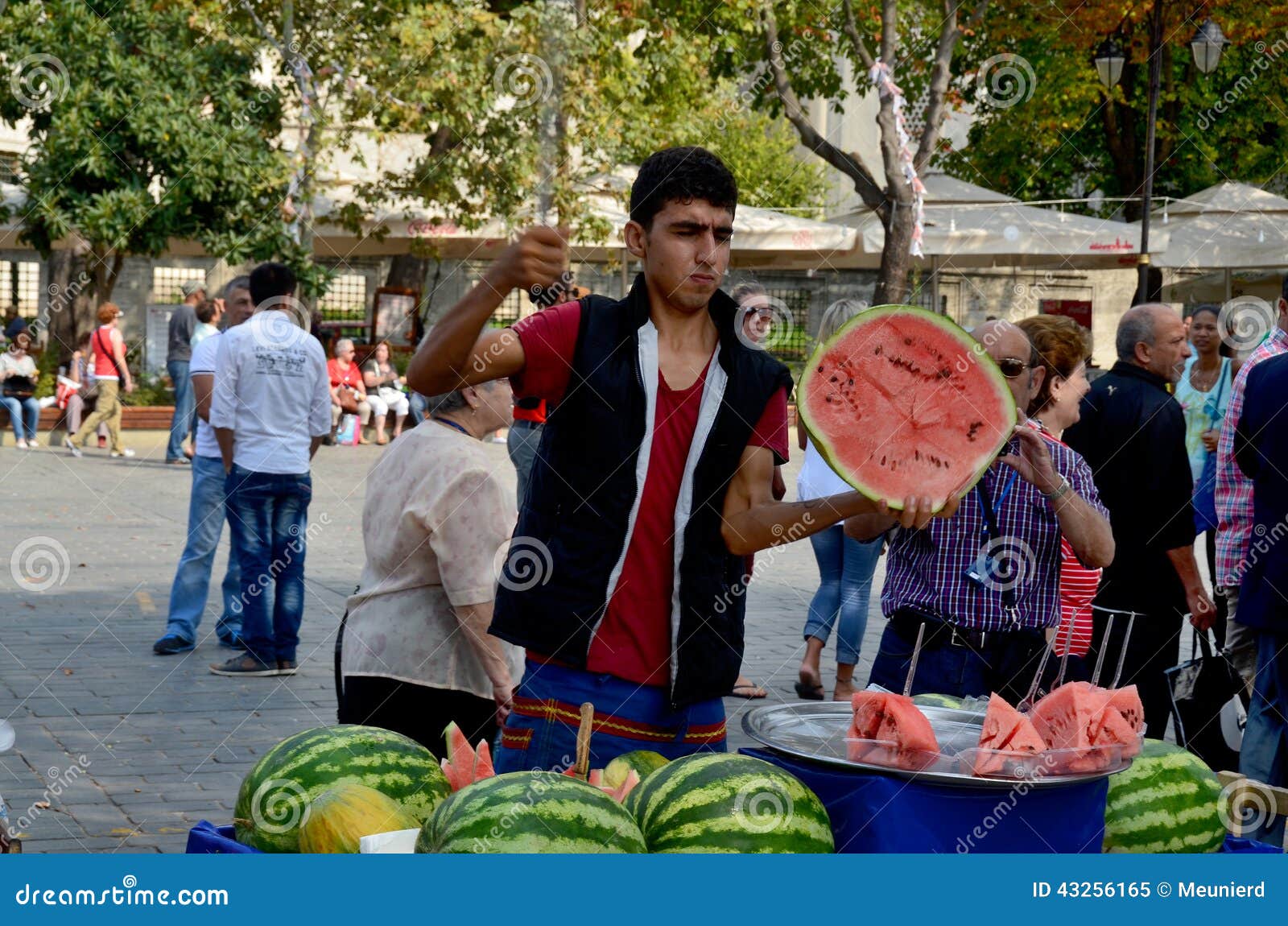 ISTANBUL,TURKEY-JUNE 7:Guys slicing watermelon to sell at their