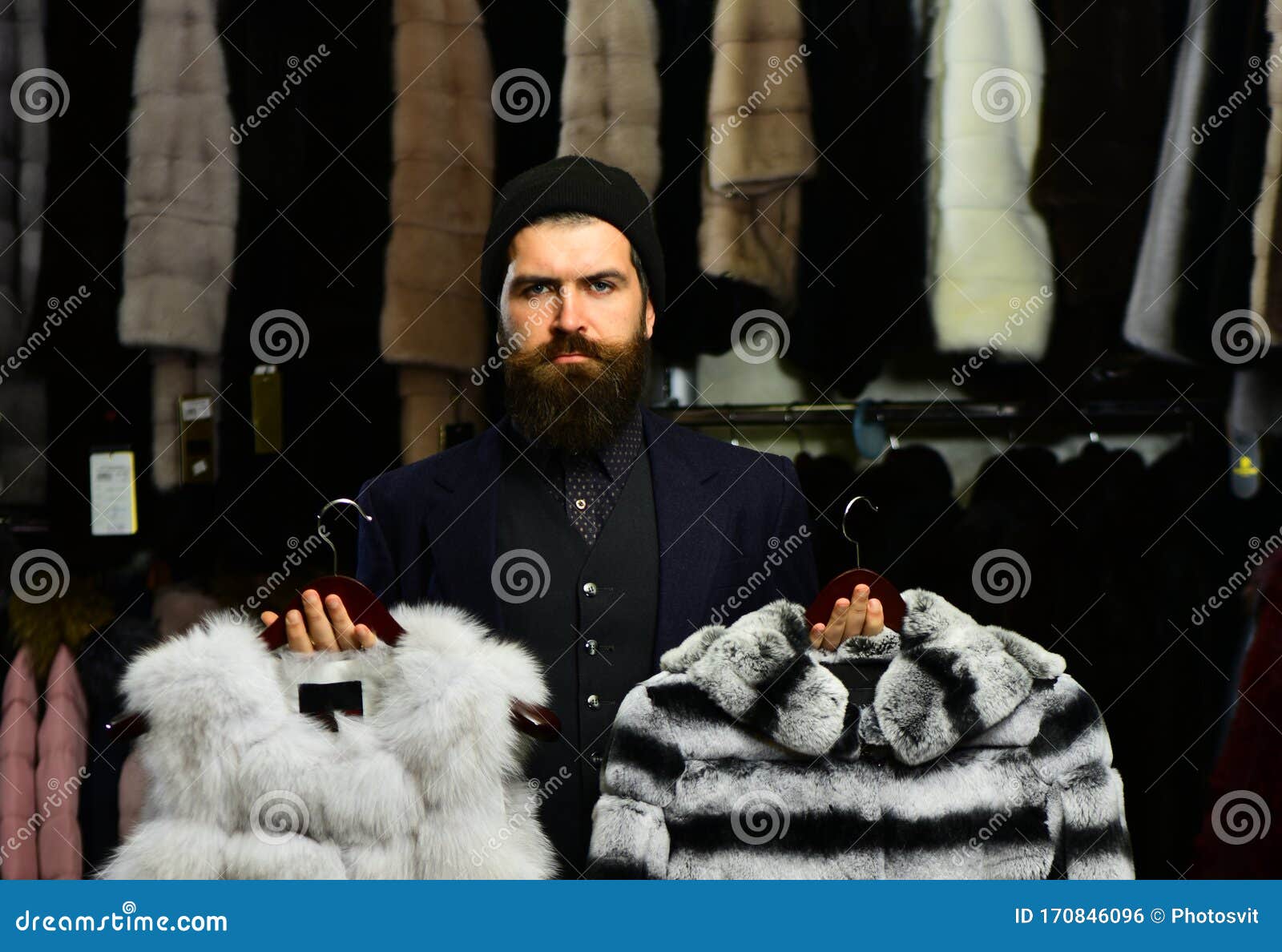 Man with Serious Face Holds Furry Coats Stock Photo - Image of furry ...