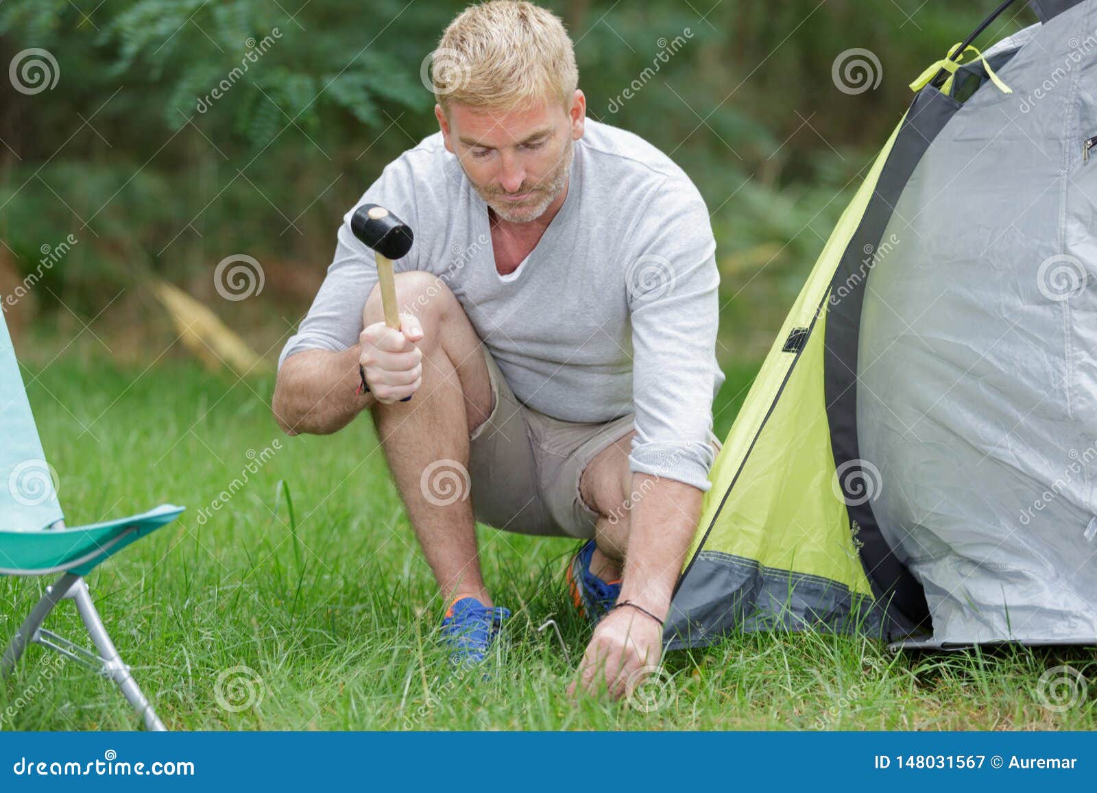Man Setting Up Tent at Campsite Stock Image - Image of installing ...