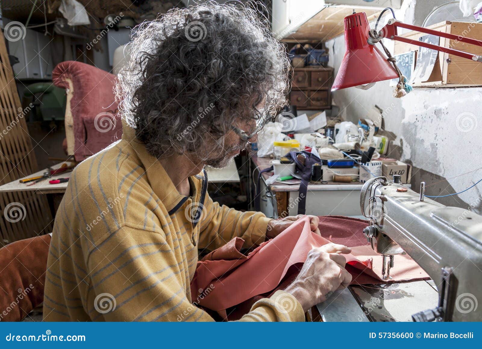 Man at the sewing machine stock photo. Image of clothing 57356600