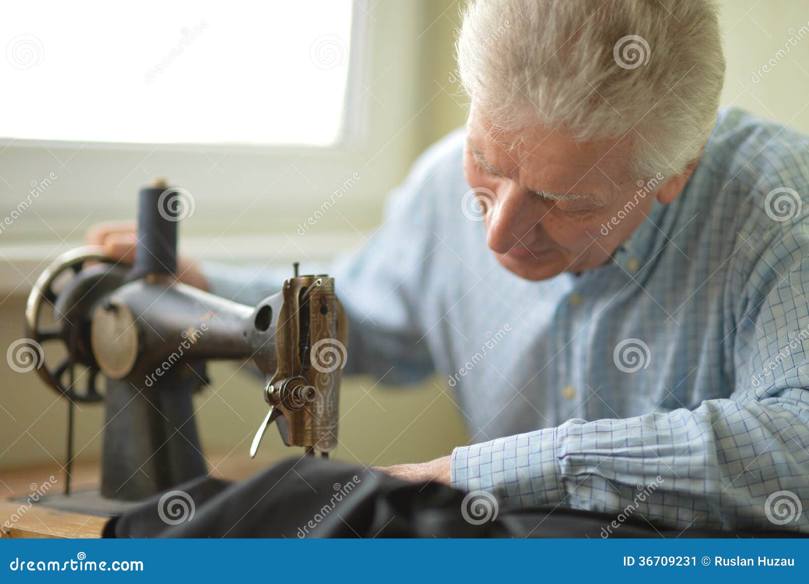 Man at sewing machine stock image. Image of home, dress 36709231