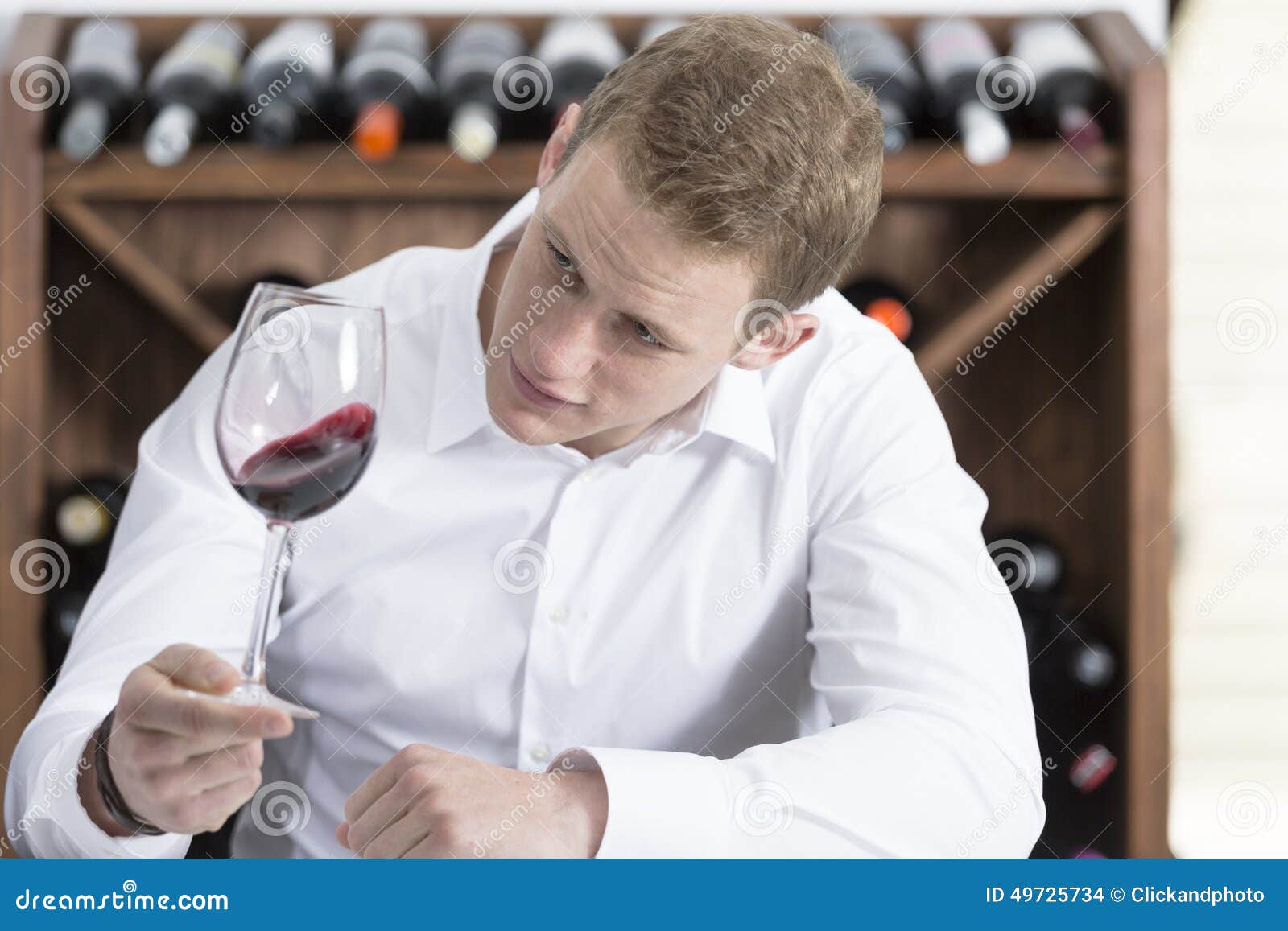 Man Shaking a Red Wineglass Stock Photo Image of wooden, bottle 49725734
