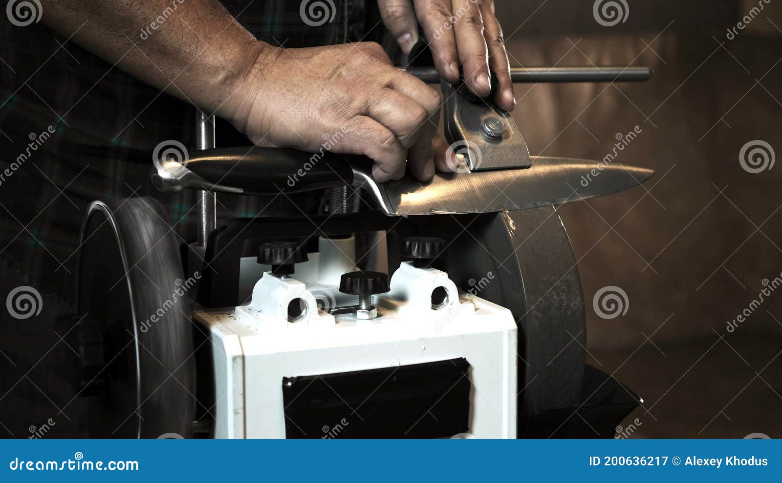 Man Sharpens Knives on a Grinder. Close Up Hand Stock Image Image of