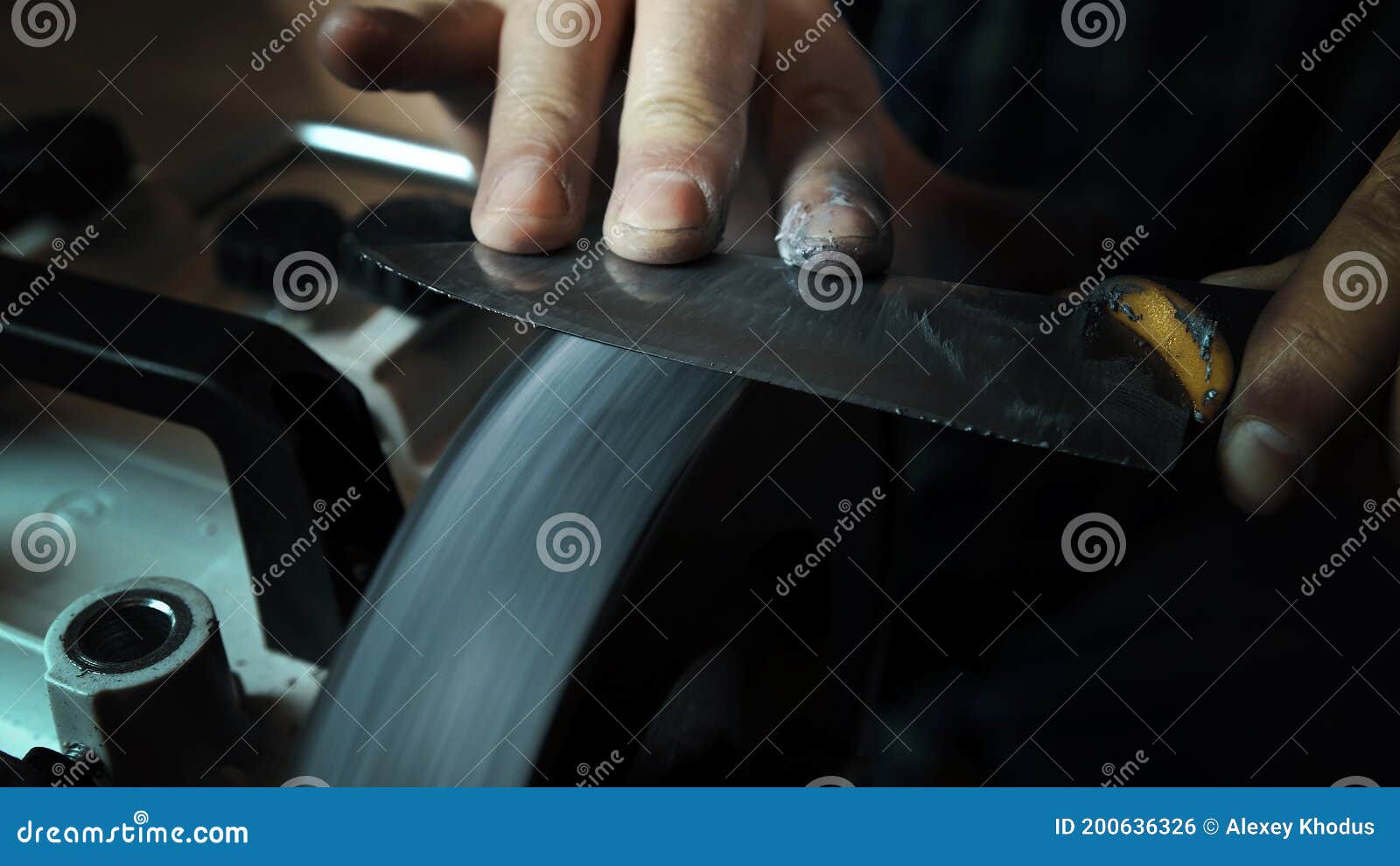 Man Sharpens Knives on a Grinder. Close Up Hand Stock Photo Image of