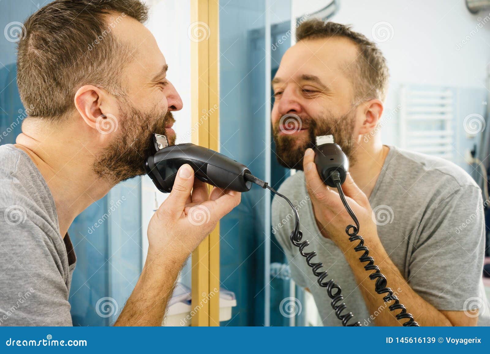 https://thumbs.dreamstime.com/z/man-shaving-trimming-his-beard-bearded-man-looking-himself-mirror-trimmng-shaving-his-beard-using-electric-timmer-razor-145616139.jpg