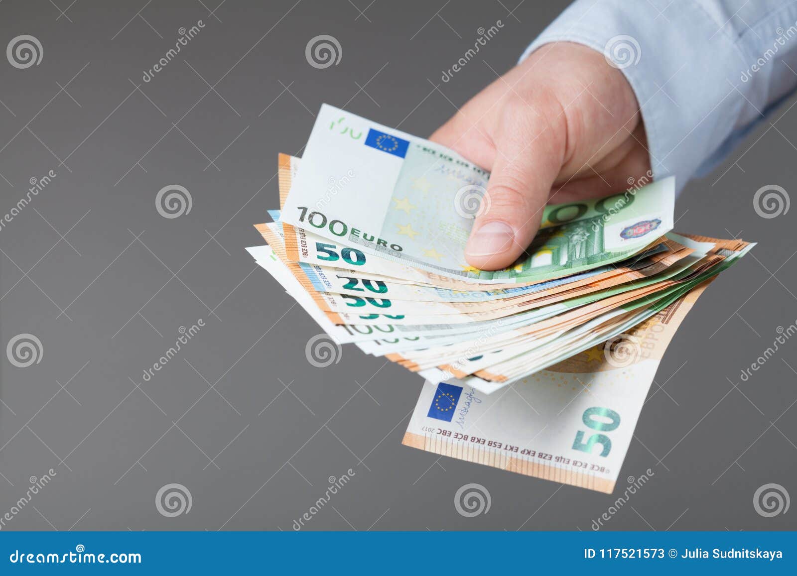 man in shirt holding euro money in his hands. banking, salary and donate concept.