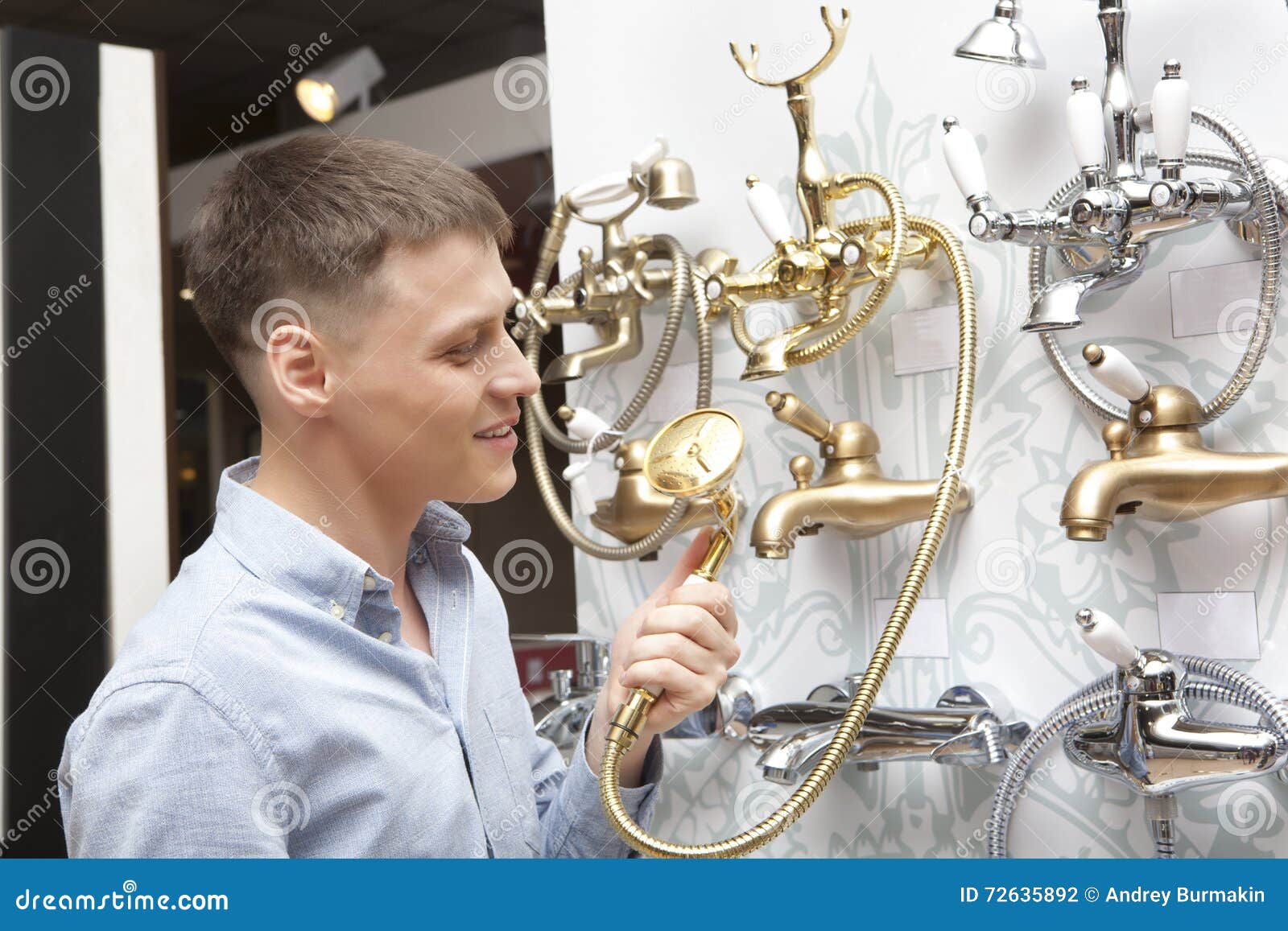 Man Shopping for Bathroom Equipment in Hardware Store Stock Photo