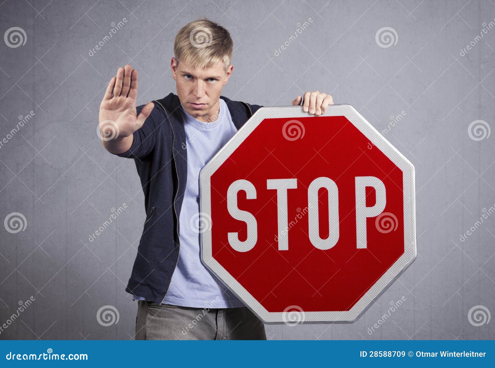 man showing stop sign.