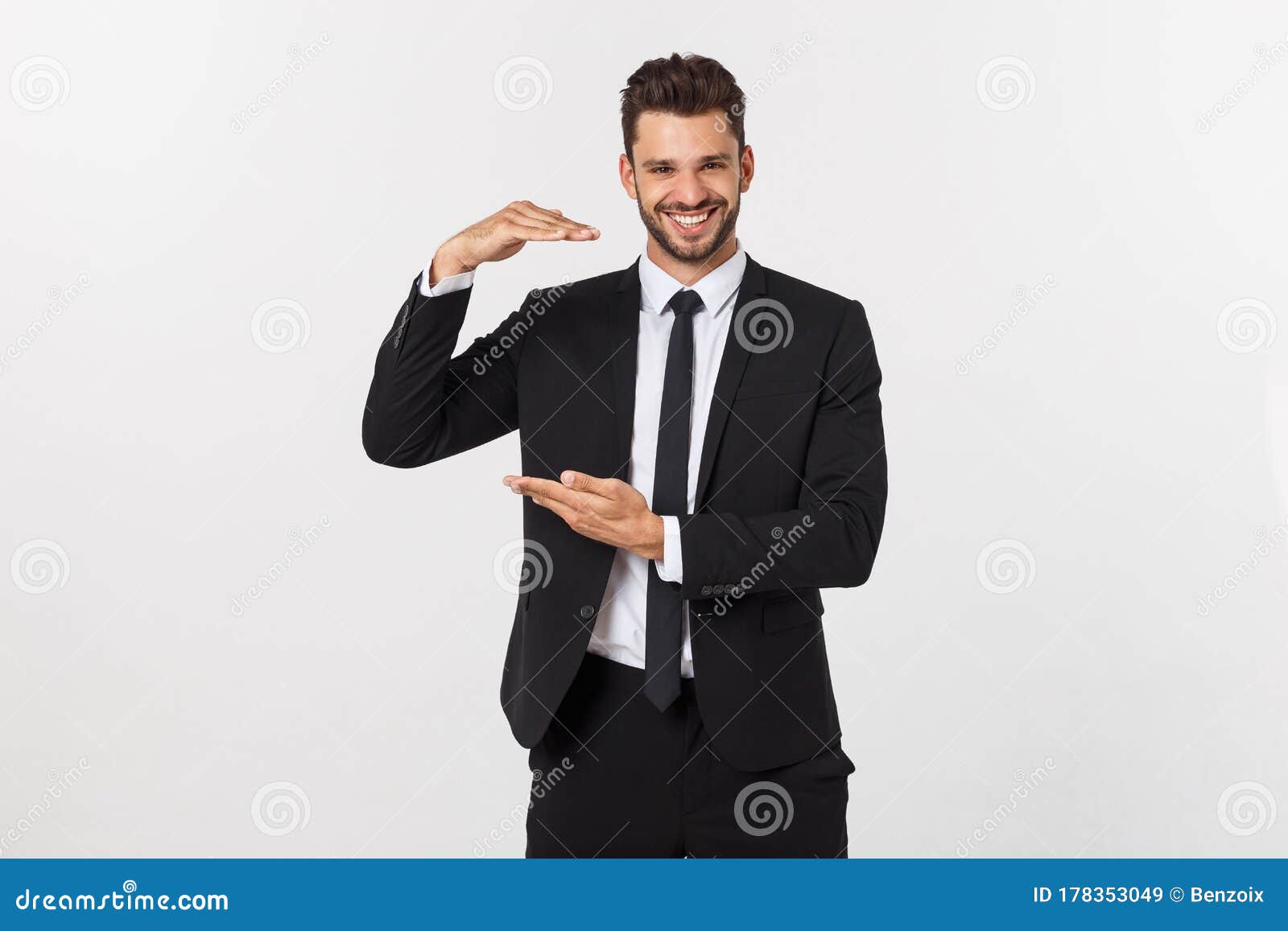 A Man Shows with His Hands a Large Size on an Isolated Background Stock ...