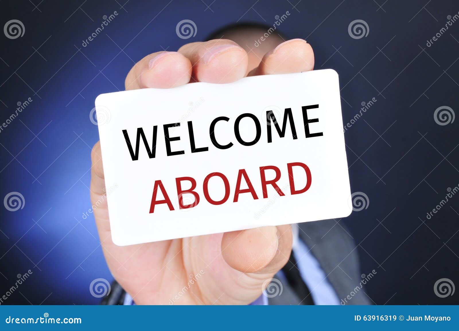 man with a signboard with the text welcome aboard