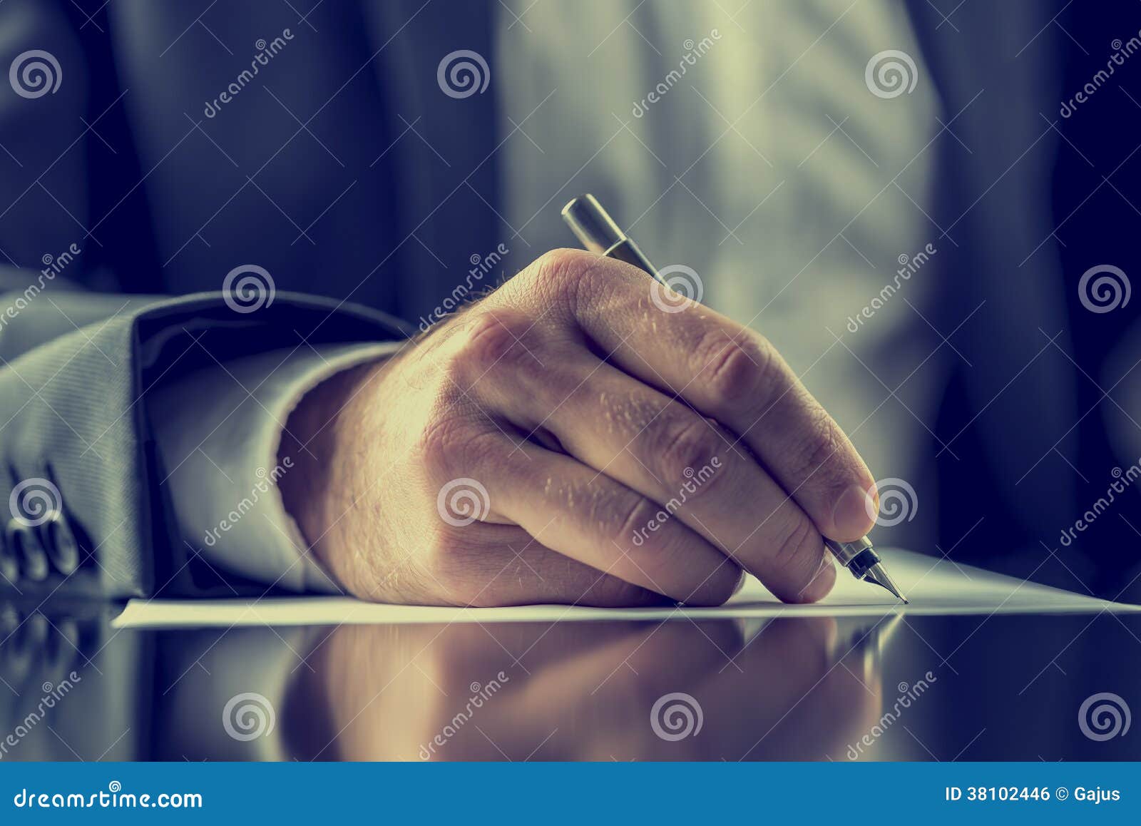 man signing a document or writing correspondence